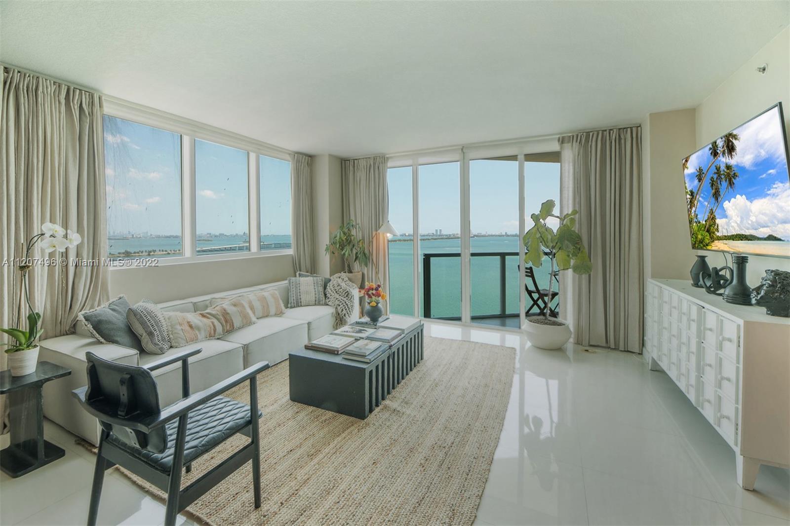 INTRODUCING THE STUNNING 1805-DESIGNED RESIDENCE AT ONYX ON THE BAY.  ENTER TO THE HALLWAY WITH A POWDER ROOM LEADING TO THE GORGEOUS LIVING AND DINING ROOM AREA WITH A OPEN KITCHEN AND BREATHTAKING VIEWS OF BISCAYNE BAY AND MIAMI BEACH SKYLINE. THIS PRISTINELY RENOVATED AND PROFESSIONALLY DECORATED LARGE CORNER UNIT WITH TWO SPACIOUS BEDROOMS W/ EN-SUITE BATHROOMS. LARGE MASTER WITH CORNER BALCONY WITH BEAUTIFUL CITY AND  SUNSET VIEWS. A BOUTIQUE BUILDING WITH GREAT AMENITIES. POOL, GYM, 24 HOURS DOORMAN. PERFECT LOCATION 10 MINUTES FROM SOUTH BEACH, DOWNTOWN MIAMI, WYNWOOD, AND DESIGN DISTRICT. AN AMAZING OPPORTUNITY TO LIVE IN MIAMI IN STYLE.