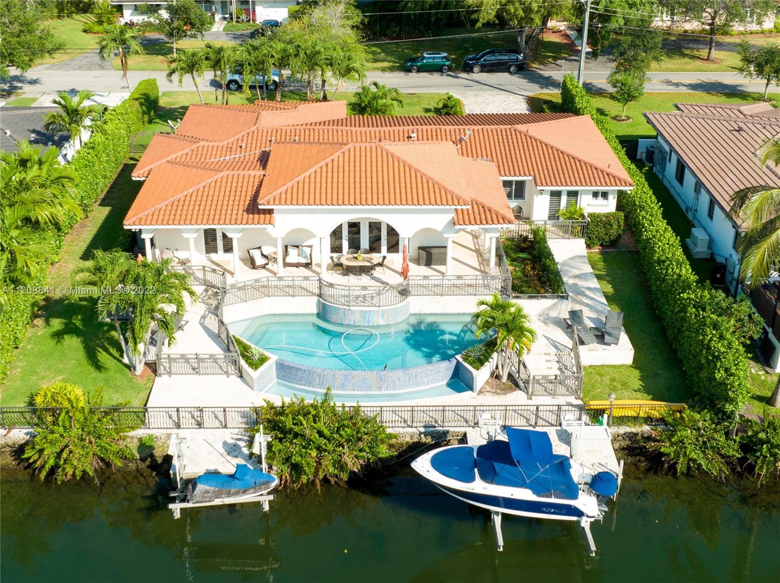 Waterway lovely Gables house located minutes away from the Riviera Country Club. Enjoy the convenience of jumping on your boat or jet ski for sunset drinks or simply enjoy the peaceful outdoor space by your infinity pool. This property offers fabulous entertaining spaces. It sits on a calm street in the heart of the Gables. The floor plan offers large open spaces and sunlight pouring in. The floors are wood throughout the home, and marble in bathrooms. The split plan allows for a separate guest room or office space.