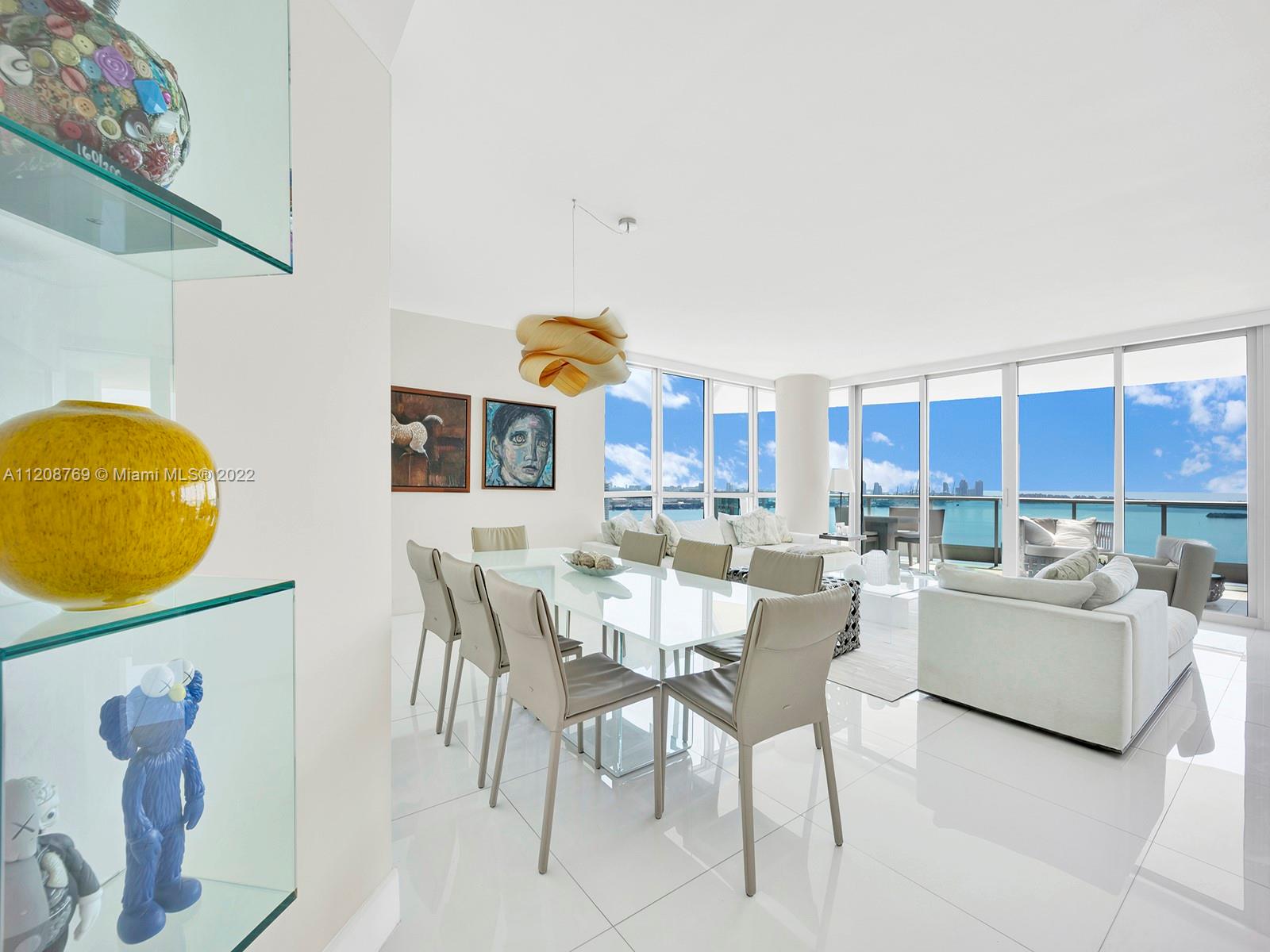 Fabulous flow through residence with expansive Biscayne Bay and ocean views to the east and Brickell skyline views to the north and west. Sunrise and sunset terraces. Master bedroom with sitting area and his/hers everything (walk-in closets, bathroom vanities, water closets). All other bedrooms with bathrooms ensuite. Private elevator opening to foyer entrance. Kitchen with breakfast area and family room beside. Living and dining surrounded by water views. Laundry room with substantial storage space plus extra storage unit under AC in building. Three parking spaces. A really comfortable residence to call your home!