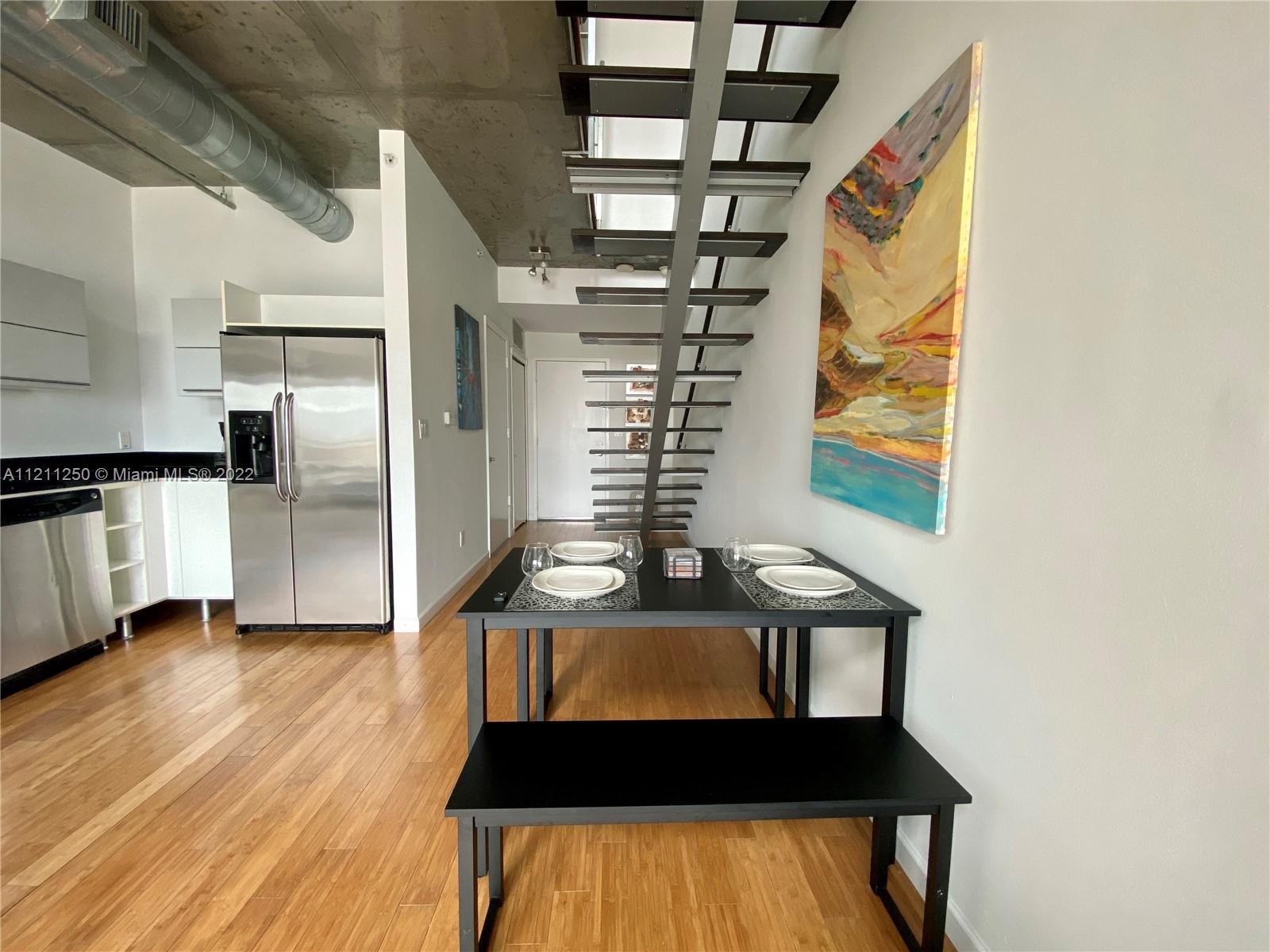 Industrial design Modern loft with amazing views of the Miami River. Beautiful 1bd/1 1.5 bath, Furnished, bamboo floors, two-story with living/dining downstairs with kitchen, half bath with built-in washer/dryer. Master bedroom & bathroom upstairs. Enjoy Miami River views and the city on Both levels. Full amenities building offering pool, gym, dog park, cigar parlor, family room, and valet service. Excellent security throughout the building. Easy to show, call agent 1 assigned parking space. If the lease is for less than 1 year the commission will be 5%. Very easy to show.