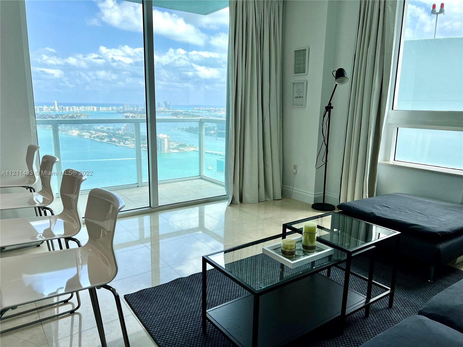 Enjoy breathtaking, unobstructed bay and Miami Beach views from this 40th floor 1 bed / 1 bath at Quantum on the Bay. This unit features an open floor plan, with views from every window. Quantum offers hotel style amenities: pool, lounge, movie theater, convenience store, secured lobby with concierge, fitness center, and much more! Conveniently located in the heart of Edgewater directly across the street from Margaret Pace Park, various cafes, and steps from the Venetian Causeway. Minutes to Miami Beach, Wynwood, Design District and Brickell. The unit is being rented full furnished, just bring your clothes and toothbrush. Won't last!