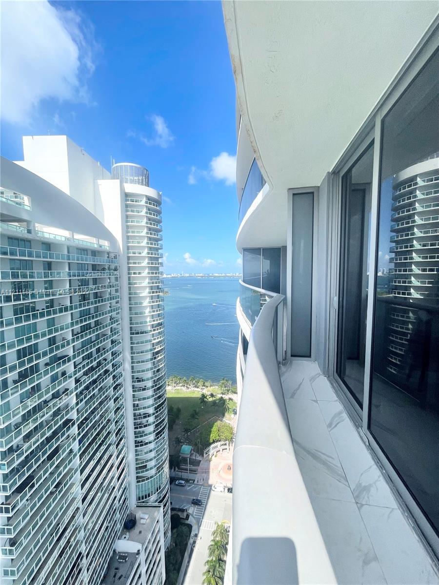 Welcome to the sexiest high-rise on the Edgewater waterfront strip, Aria on the Bay. Residence 3201 is a magnificent, fully furnished corner unit on a high floor featuring two master suites, each with their own full bathrooms, walk-in custom closets and exclusive balcony access. The unit also features a guest bath, Bosch appliances, open layout kitchen and living area, washer/dryer, built-in closets, custom blinds and one designated garage parking space. Indulge in stunning panoramic views from the enormous wrap around balcony. Internet, water and parking all included. Amenities include sunrise and sunset pools, infinity hot tub, gorgeous social areas, pool tables, business center, sauna, steam room with pool views, massage rooms, fitness center, kids club and so much more.