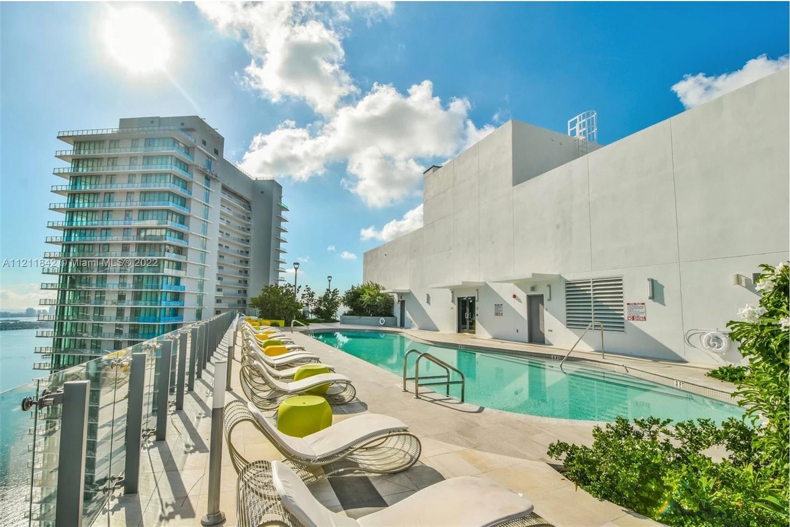 Amazing Huge 3 Bedroom 2 Bath in Brand New Buidling, Paraiso Bayviews, in Miami Edgewater/Midtown. Breathtaking views from the 2 balconies in the unit and the Rooftop Pool and Jacuzzi on the 46th floor with 360 views of Miami and resort-style towel service!! Enjoy access to all 5-star amenities including lounge pools, cabanas, tennis court, party rooms and more! Includes 1 assigned parking spot in garage. This unit has amazing views of the bay & ocean from the 31st floor and features porcelain flooring throughout, a total of 4 beds with a king-size bed in the master, 2 twin beds in the 2nd bedroom, (can use apart or separate), queen-size sofa-bed in the converted den. Ultra-Luxury, Ultra-Modern building with 24-hour security, front desk and valet.
