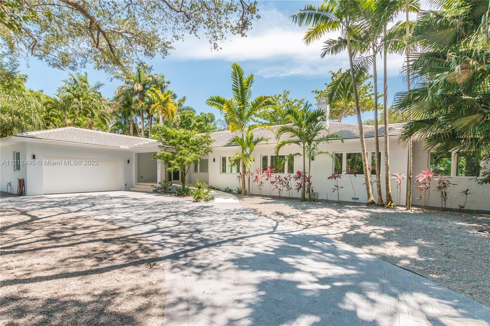 Completely renovated home on oversized lot on a private cul-de-sac, Oak canopied and sought after Leafy Way.  Located in prestigious South Coconut Grove. Residences plumbing, electrical, mechanical, roofing, impact windows and doors, flooring, appliances, kitchen and bathrooms, audio wiring and saltwater pool completed in 2014. Main house has a split floorplan with oversized grand bedroom, bath and closet space on one side and 3 bedrooms plus den/office on the other end. In addition, there is a separate guest house with full bath and kitchen. 2 car AC’d garage. Fully ADA accessible. Walking distance to the Grove village center’s eateries, shops, Bayfront parks and marinas. New landscaping throughout the grounds.  This home has it all. Bright spacious floor plan with high ceilings.