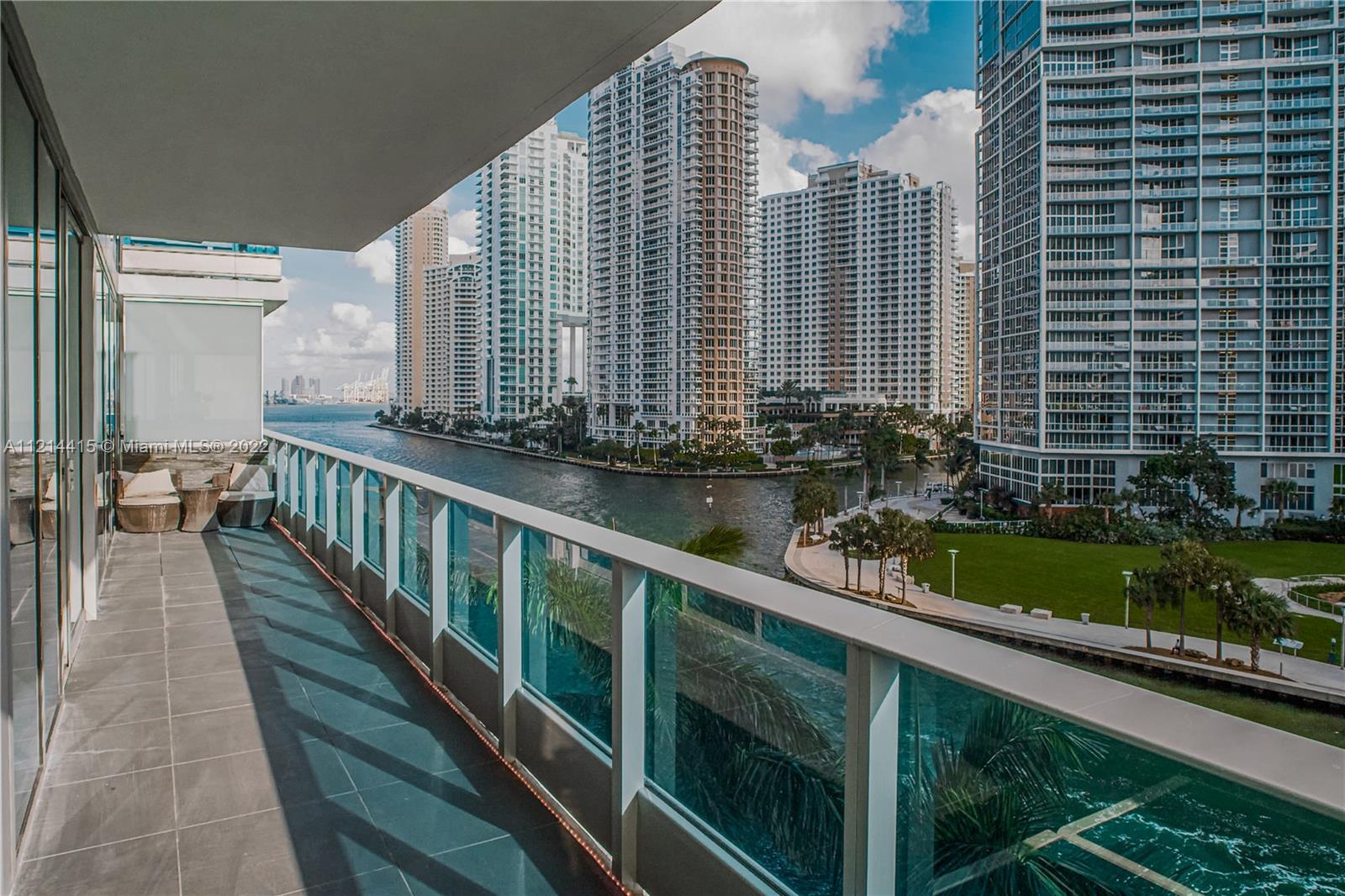 Live Limitlessly in this spectacular two-story unit overlooking Biscayne Bay and the Miami River. Featuring high ceilings with tons of natural light, spacious walk-in closets and a generous sized terrace. This modern-day residence has been renovated with brand new tile flooring, an encased glass staircase, and updated touches throughout. Utilize the den area as an additional bedroom for overnight guests or a home office. Whether it's basking out on the terrace to watch the boats go by or simply walking across the street for a quick grocery run at Whole Foods, you can't go wrong with one of Miami's most prized locations.