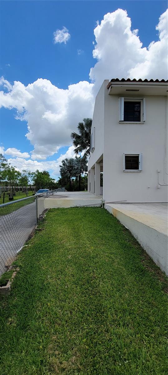 Rear view Guest house, side-backyard of residence