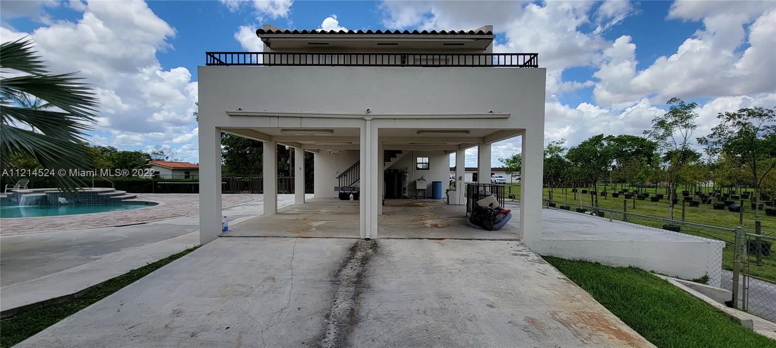 Rear side of residence driveway to Guest house