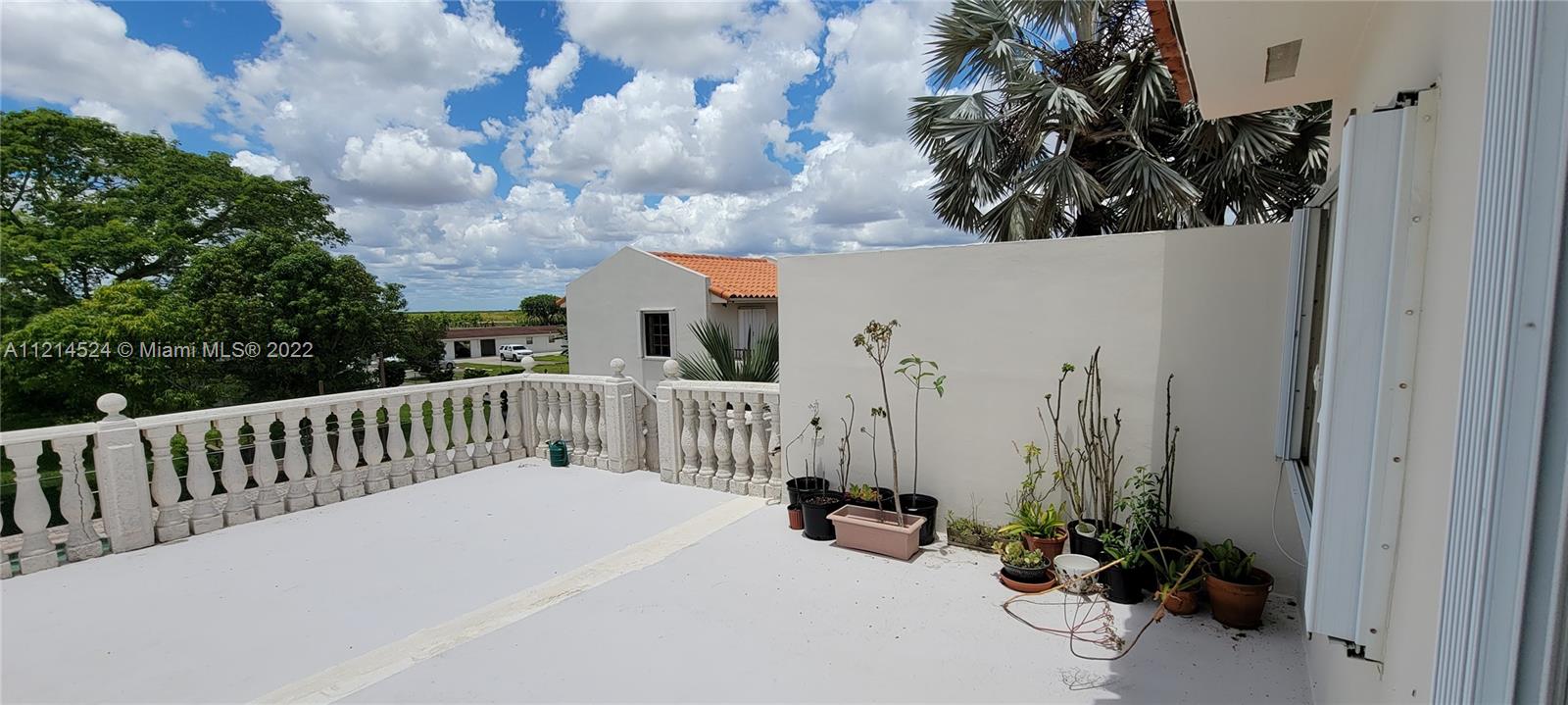 2nd floor balcony patio overlooking acreage to northwest