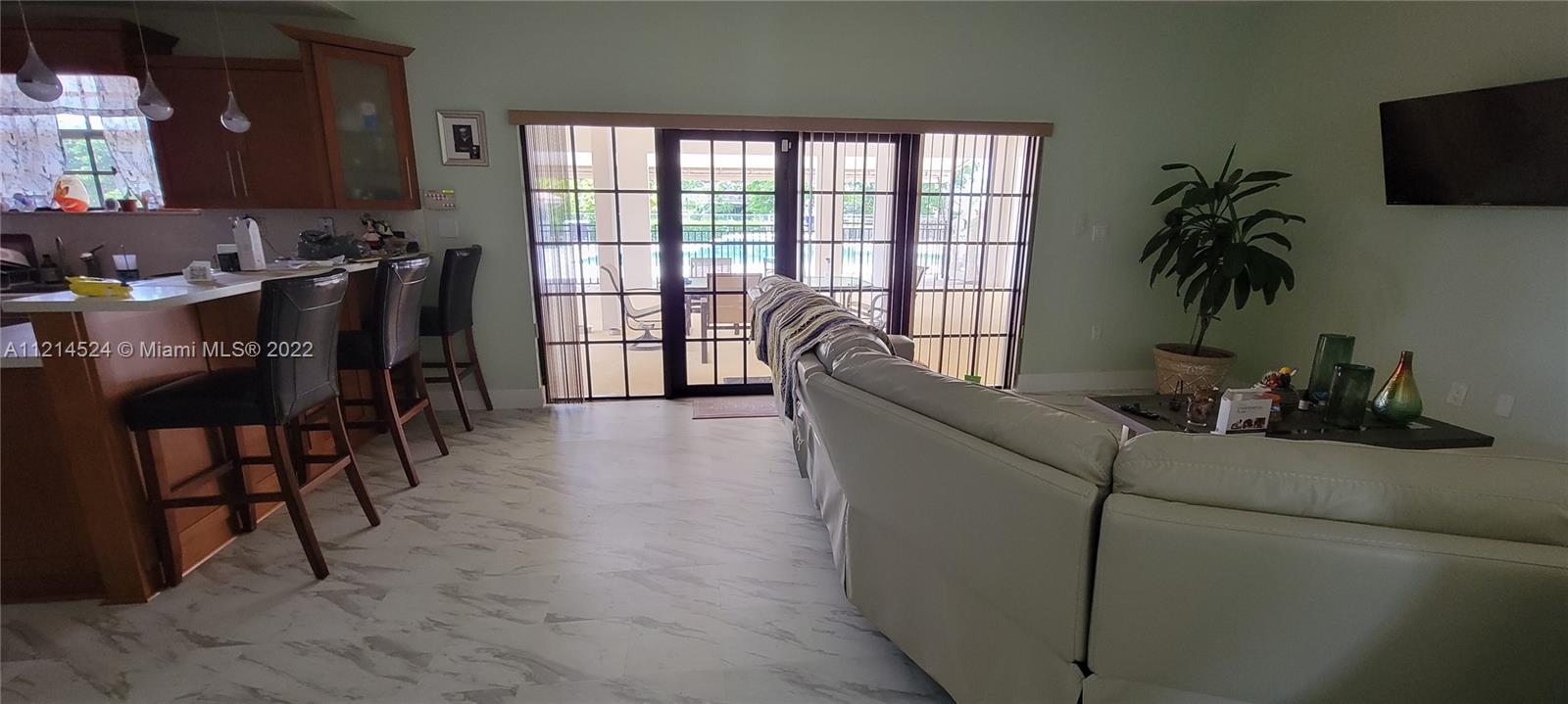 Family room overlooking covered patio - pool/spa deck