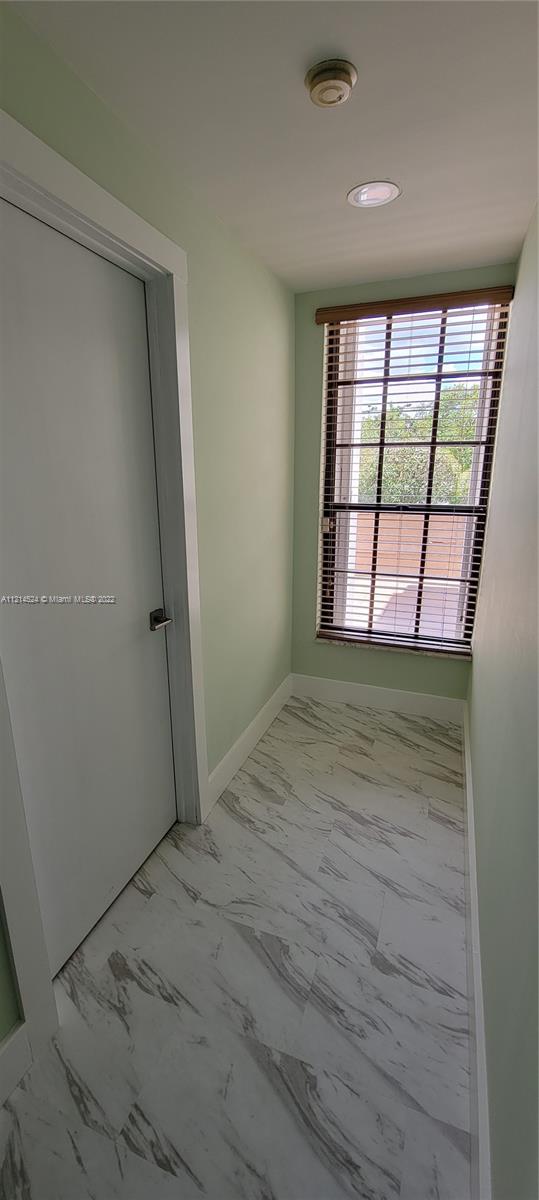 1st Floor: Hallway view to front/east and Northeast corner bedroom1