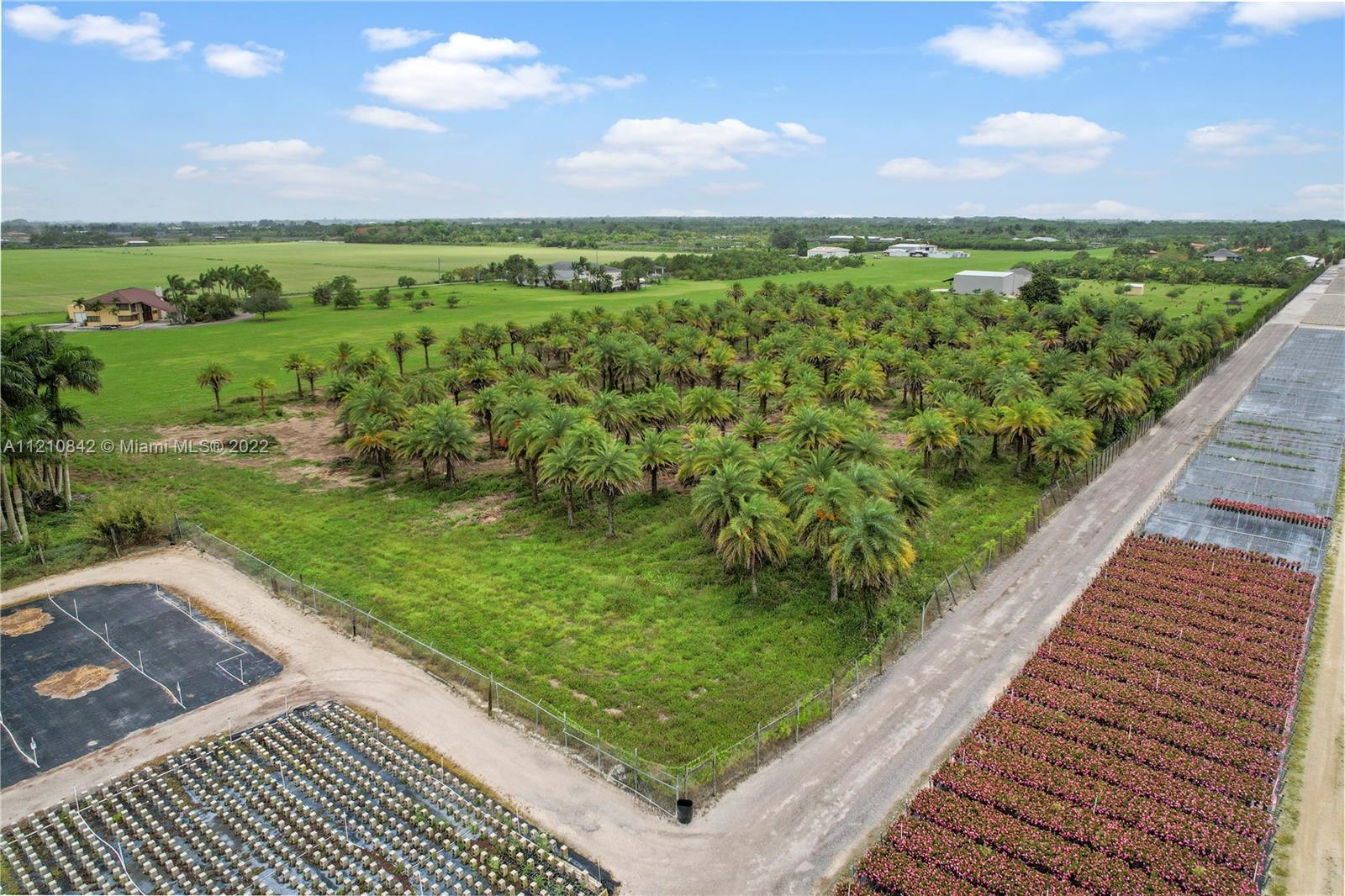 A VIEW FACING TOWARDS THE SOUTH WEST WITH HOMES AND HANGERS . THIS NURSERY IS TO THE NORTH OF PROPERTY AND OUTSIDE OF RICHARDS EXCLUSIVE COMMUNITY