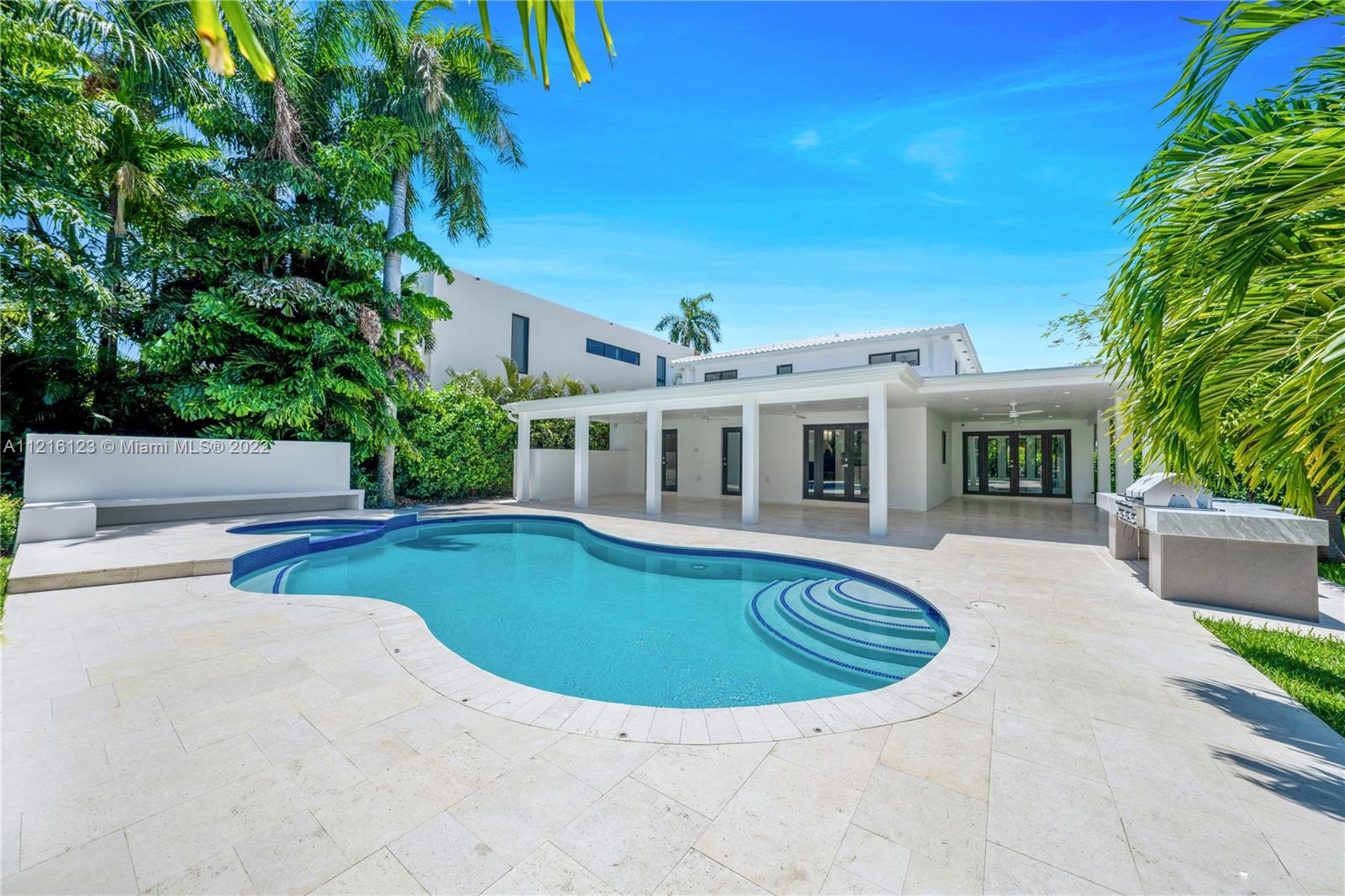 NEWLY RENOVATED PRISTINE WHITE TROPICAL VILLA OVERLOOKING PRESTIGIOUS MIAMI BEACH GOLF COURSE WITH STUNNING SUNSET VIEWS! Modernized Home on Huge 11,400 SF Gated Corner LOT. Prime Location on Meridian Ave w/ Great Walkability. 4 Beds + 3.5 Baths in 4,322 Total SF. Entertaining Spaces w/ Recessed Lighting & Vaulted Ceilings + Dining Area w/ Indirect Lighting. Chef’s Eat-in Kitchen w/ Quartz Countertops, SS Appliances & Viking Gas Range. Primary Suite + Terrace w/ Golf Course Views. Primary Bath w/ Walk-in Closet + Steam Rainshower. 2nd Floor Deck can be Converted to Additional Outdoor Space. Deck & Covered Loggia off Kitchen. Outdoor Bar w/ BBQ, Saltwater Heated Pool + Spa. Linear Air Diffusers & Surround Sound Speakers. Great for Car Enthusiasts w/ Parking for 7+ Cars.