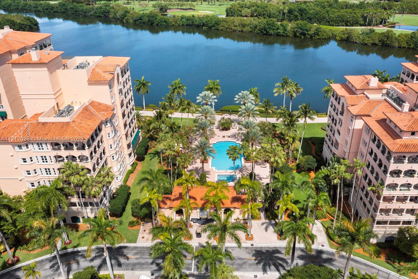 Paradise awaits in this beautiful condo in Deering Bay Yacht & Country Club's Padua building. This 2-bd, 2.5-ba condo features open views of the gorgeous community from the wide balcony, a large living/dining room, eat-in kitchen w/ adjacent family room + a bonus office/den that opens to the primary bedroom. Lovingly maintained, this unit has both marble floors + wood floors throughout. There is no shortage of storage space w/ generous walk-in closets in both bedrooms, 2 pantry closets + a laundry/utility room. Also included a large, air-conditioned storage space, 2 dedicated parking spaces, plus an added space for a golf cart. Deering Bay offers an amazing quality of life w/ its Clubhouse, resort-style pools, golf course, 3 marinas, tennis courts + more (Club membership is separate).