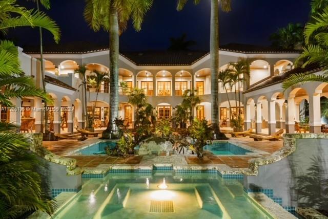 Villa Las Palmas, an evening view. 
5 ACRES~ 23 ROOMS ~8 BEDS/7.5 BATHS~ 22,000 TOTAL sq. footage 12,000 UNDER AIR & 10,000 COVERED EXTERIOR