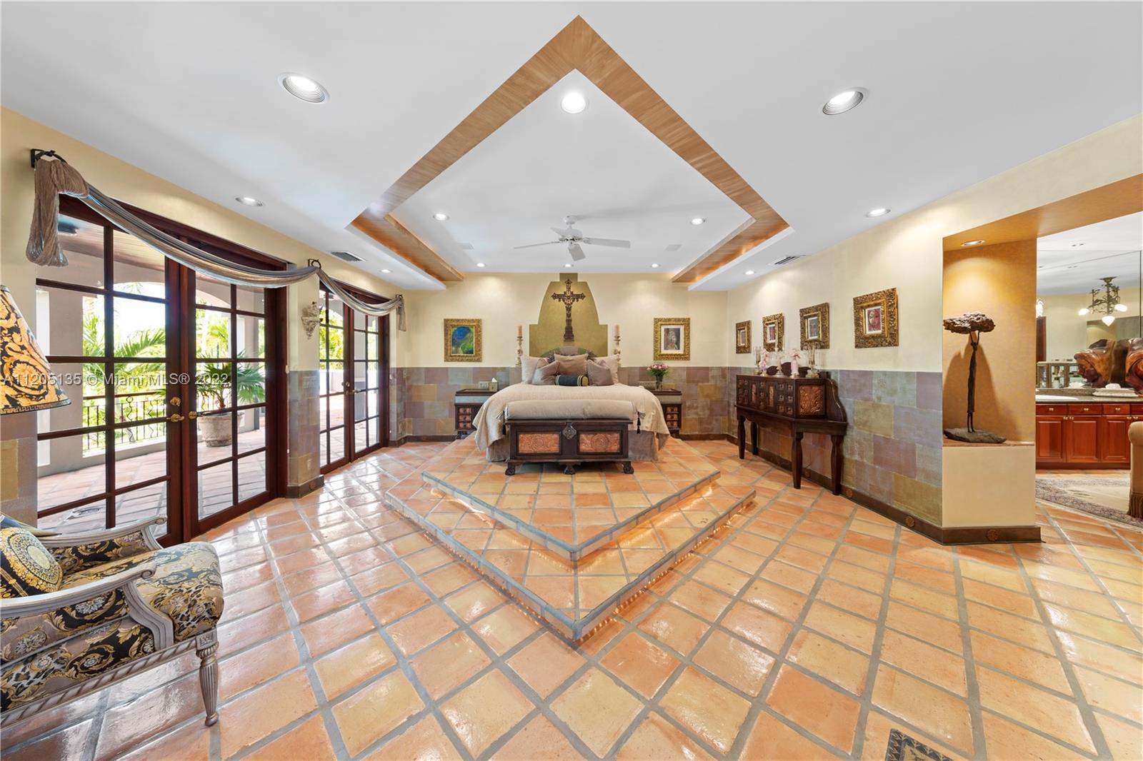 The main suite utilizes the upper level. There are a total of 3 closet spaces with floor to ceiling cabinetry in dressing area. There is an H n H oversized walk in while the third floor is a bonus space for seasonal clothing/ storage. All the baseboards are copper. Notice the diamond design is reflected thru the space.