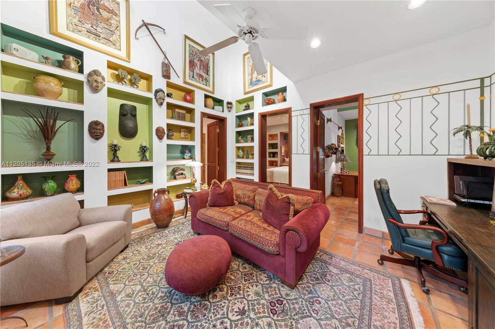 Back to ground floor. This area house's 3 suites, each suite has a walk in w mahogany shelving and drawers and has customized ceilings w some built in furniture and a full bath.  All open to this sitting room/ work place with plenty of alcoves for books & art.