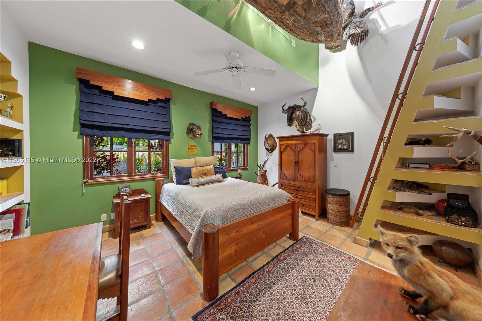 A masculine feel in the 3rd n final suite in this wing that opens to living area. A stairwell leads up to a nice size useable loft . Each bedroom reflects the personality of its occupant.