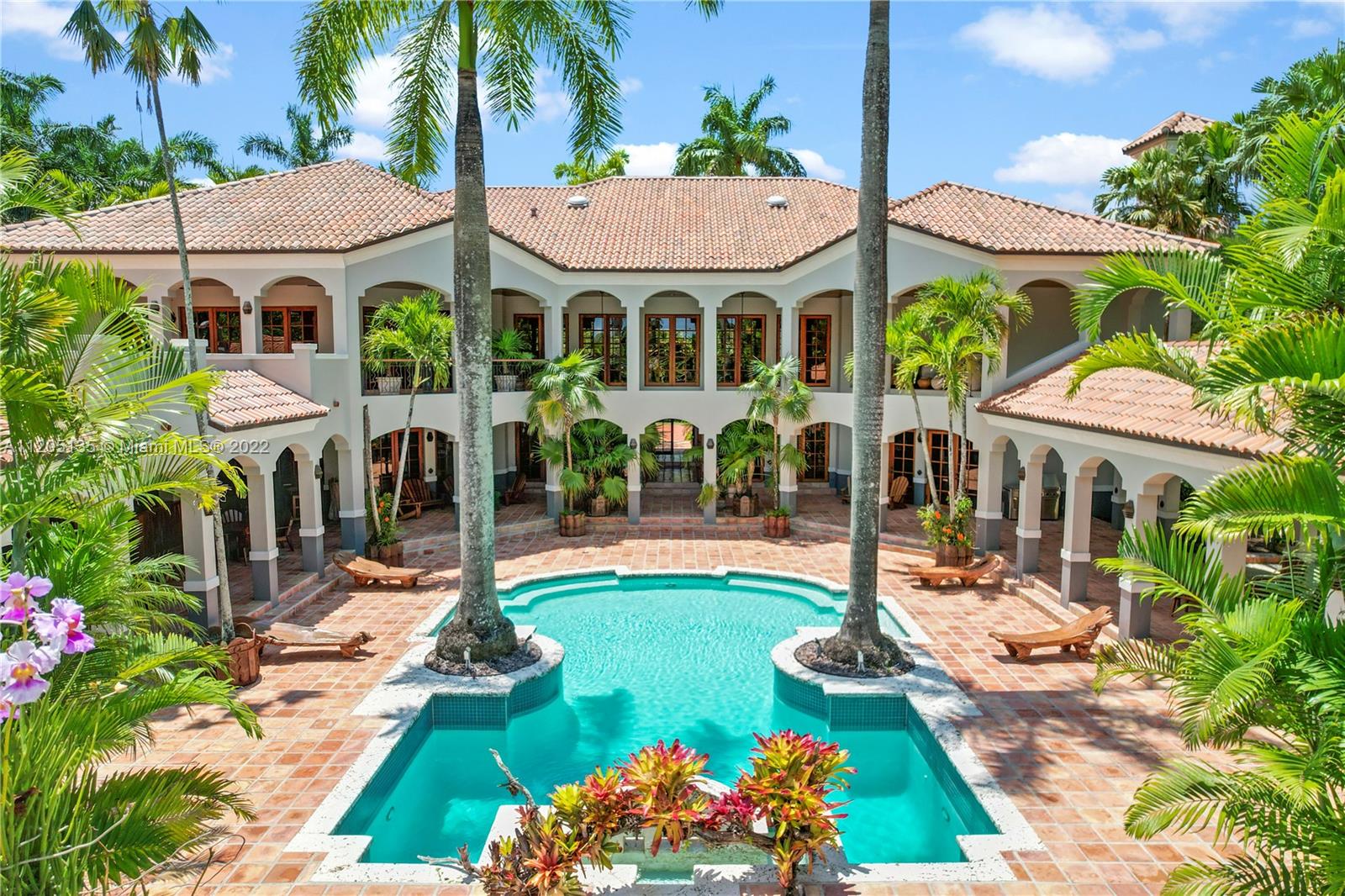 Rear(partial) patio view of Villa Las Palmas. A 10 feet deep pool w/rain curtain waterfalls & Jacuzzi (unseen). Over 20 sets Mahogany doors allows amazing natural light thru out the interior of this estate. The following photos will show the layout of patio.