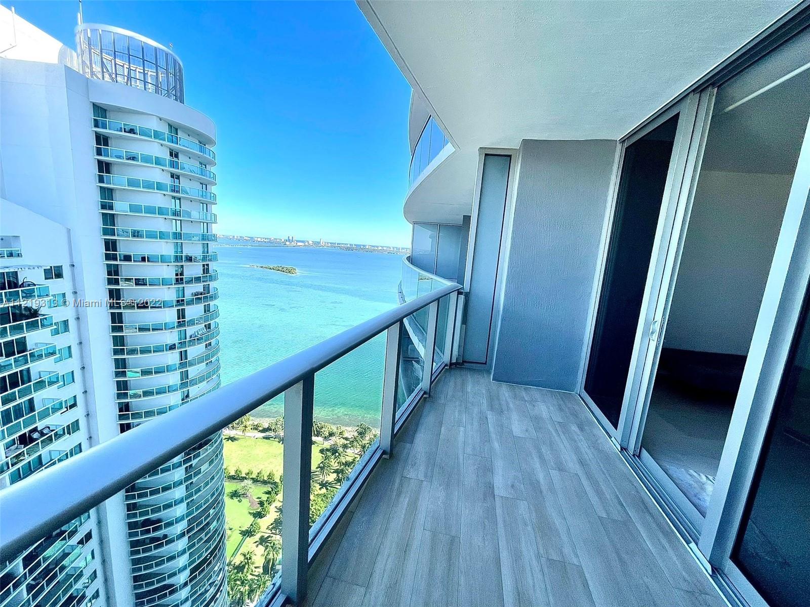 Luxurious Brand New Condo with Spacious 1 Bedroom + 1 Den / 2 Full Bath, a large balcony overlooking the ocean and city and porcelain floors. Den has been enclosed as a second bedroom and a spacious closet added. Aria is a new building with spectacular views, amenities and a beautiful park across the street. Unit has ceramic floors, kitchen with top of the line appliances, Built In Closets and blackouts and solar shades. One assigned parking space, two pools, gym, valet parking and nicely appointed party rooms.