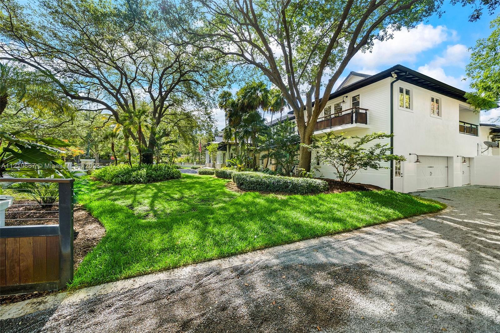 Double gated entry and driveway to 3 car garage