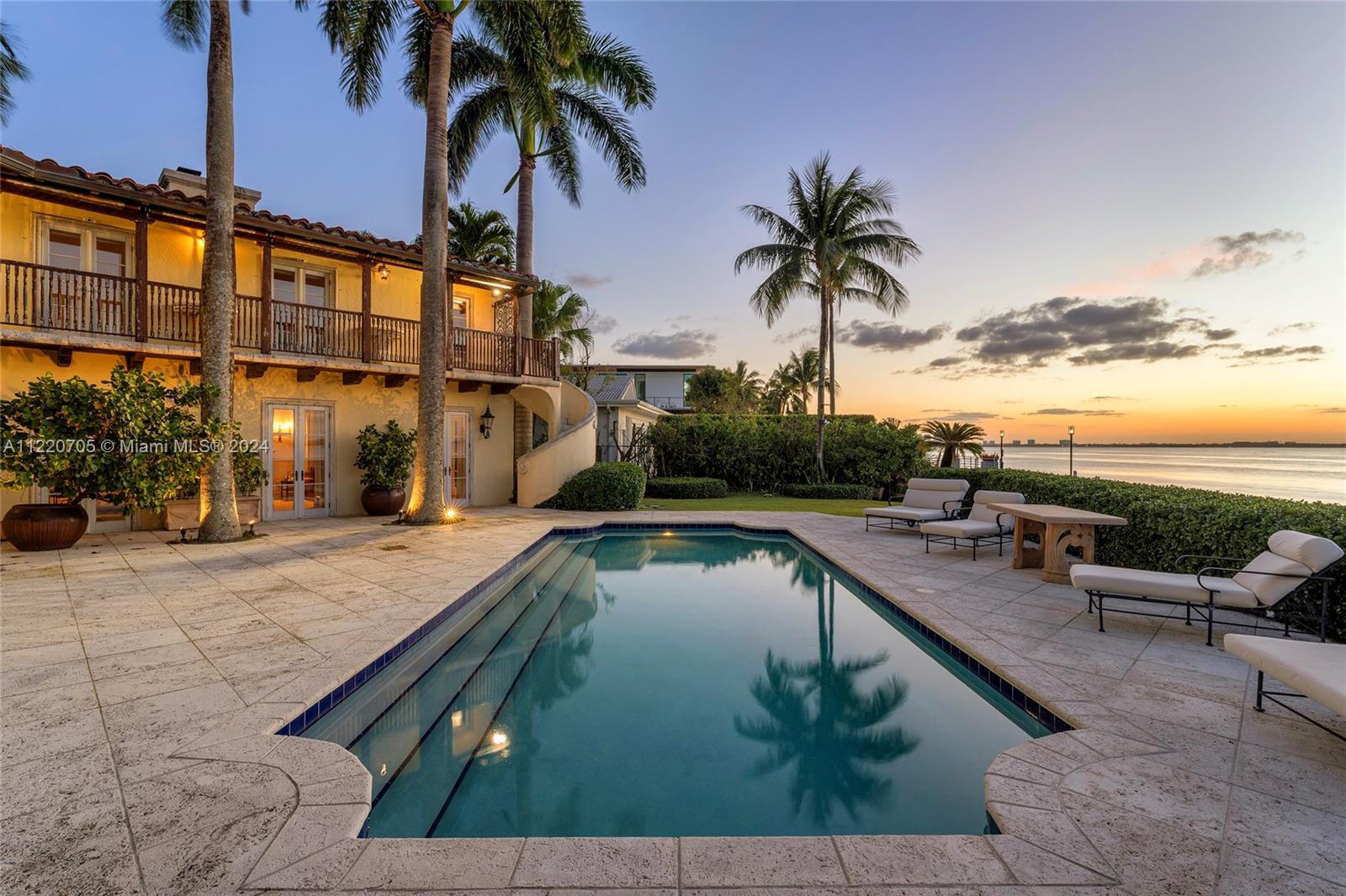 Located on prestigious North Bay Road this 2-story Mediterranean waterfront home sits on a private 20,100 SF point corner lot in a cul-de-sac with open Biscayne Bay and Miami skyline views plus 230’+ of sparkling water frontage wrapping around to protected waterfront with a private dock. Features 5BR/5BA, a gated security entrance, Chicago brick driveway, and a  serene interior courtyard with fountain. Outdoor highlights include mature lush, landscaped grounds and gardens, a large pool with natural coral deck, covered seating area with alfresco table, second story balcony with views to bay. Location , Views , land , Water frontage!!