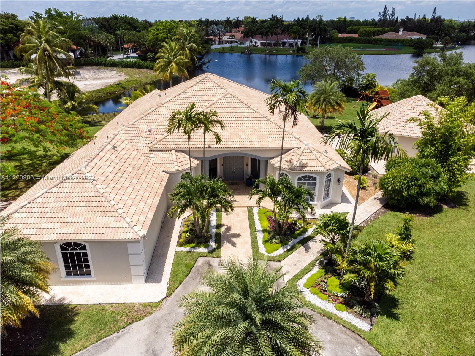 Come see this gorgeous home in sought after City of Weston, with 6 bedrooms/ 6 bathrooms, plus 1 bedroom/1 bathroom guest house, for in laws or out of town visitors! From the moment you step in, you will love how bright and full of light this home is, with new porcelain floors, remodelled kitchen with quartz tops and stainless steel appliances, stunning lake view, high ceilings and modern, open feel!Spacious living areas, with great layout and very nice flow. Each bedroom has its own bathroom, and all bathr. have been remodelled. The property, great for large families or to entertain, is fenced and landscaped, with heated pool, offers stunning lake views, and over 1.3 acres to make this your own private oasis, with enough space to build a putting green, custom made playground and more!