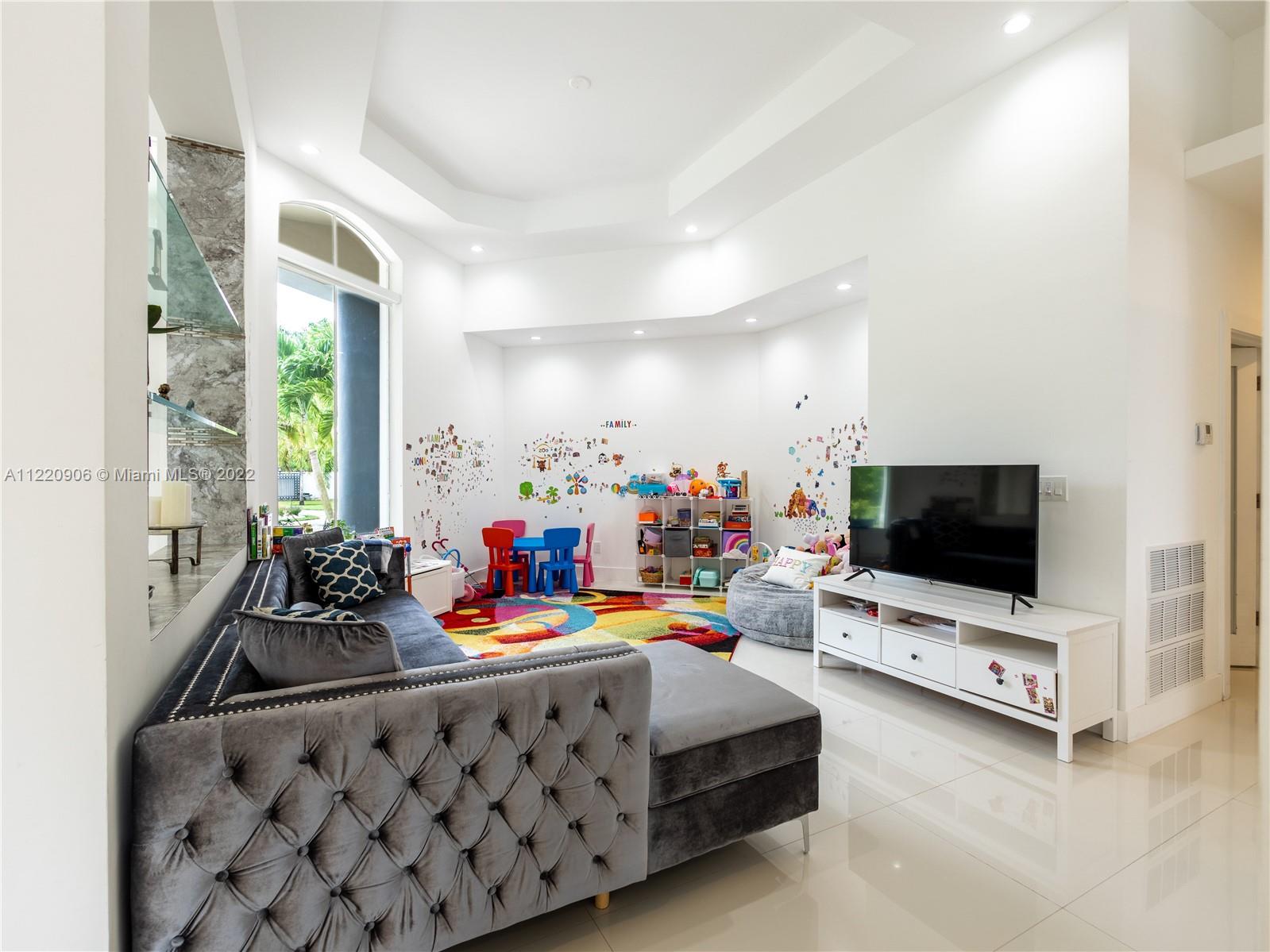 Formal Dining Room currently used as playroom for toddlers