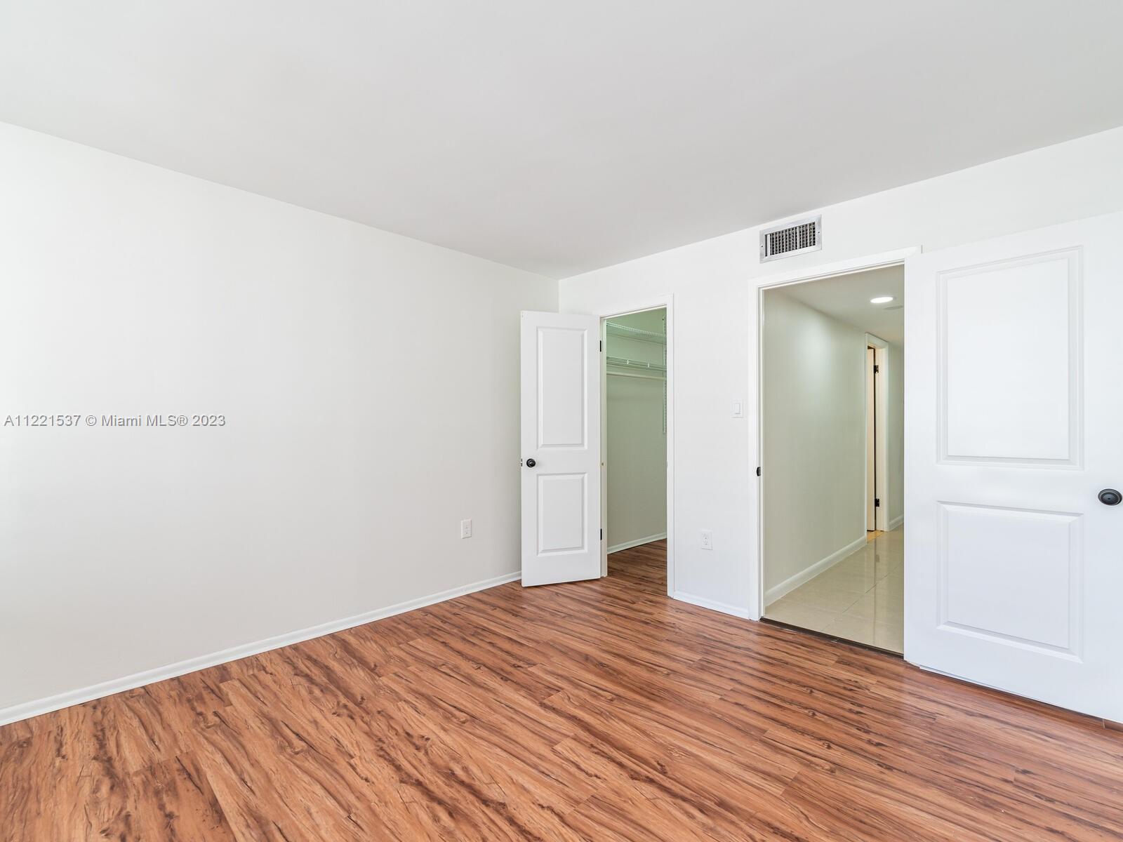 Second bedroom with walk-in closet. All doors are brand new white doors.