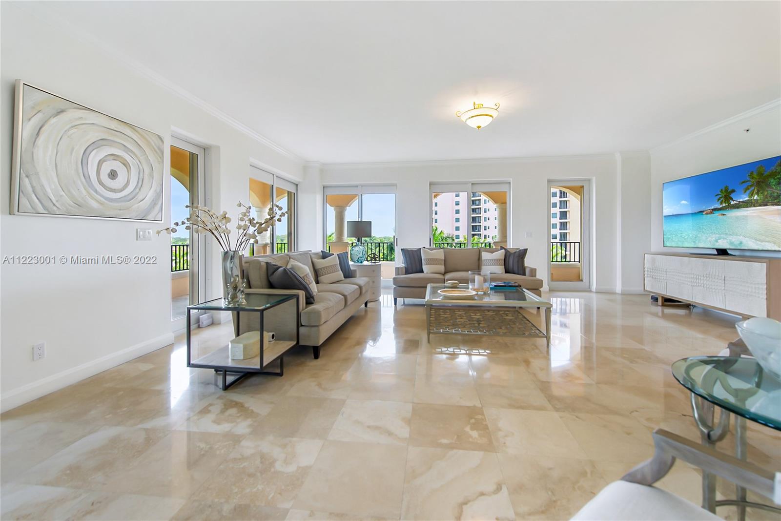 Welcome to Deering Bay! This beautiful 3BD/3.5BA condo in the Padua building is your ticket to the best resort living in Coral Gables. Abundant natural light fills this large, high-floor, corner unit featuring spacious bedrooms & living areas. Kitchen features a breakfast nook w/ Subzero and Thermador appliances. Master suite with sitting area, separate office, walk-in closets & custom built-in cabinets. Marble & wood floors throughout. The large, covered terrace wraps around the unit and provides sweeping views from the west to the northeast allowing you to enjoy sparkling sunsets and the Downtown Miami skyline. 2 garage parking spaces + golf cart space + A/C storage unit. Guard-gated grounds, secure building with 2 units per floor. Separate Golf Club & Marina memberships available.