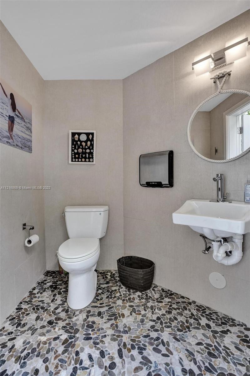 Cabana Bath with Touchless Faucets and Hand Dryer