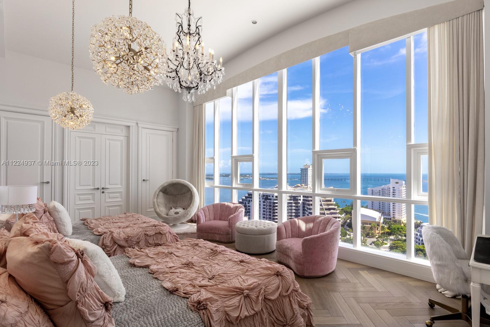 Spectacular and rarely available 2-story penthouse at the exclusive and private Brickell Key island in the upscale financial and residential district of Miami, with the most amazing views of Biscayne skyline. Professionally designed by world renowned architect Allan Malouf, this home includes the exact kitchen showcased from the Aster Opera Hall Collection in Milano, along with Designer’s custom made European doors, wall panels and closets as well as European oak Chevron hardwood floors from France and marble slab floors throughout the home and bathrooms. Two balconies and large oversized windows, 2 tandem parking spaces including a storage unit. ADA and Handicap Compliant with a full bathroom and bedroom on the first floor as well as maid's quarters with full bathroom, closets & laundry.