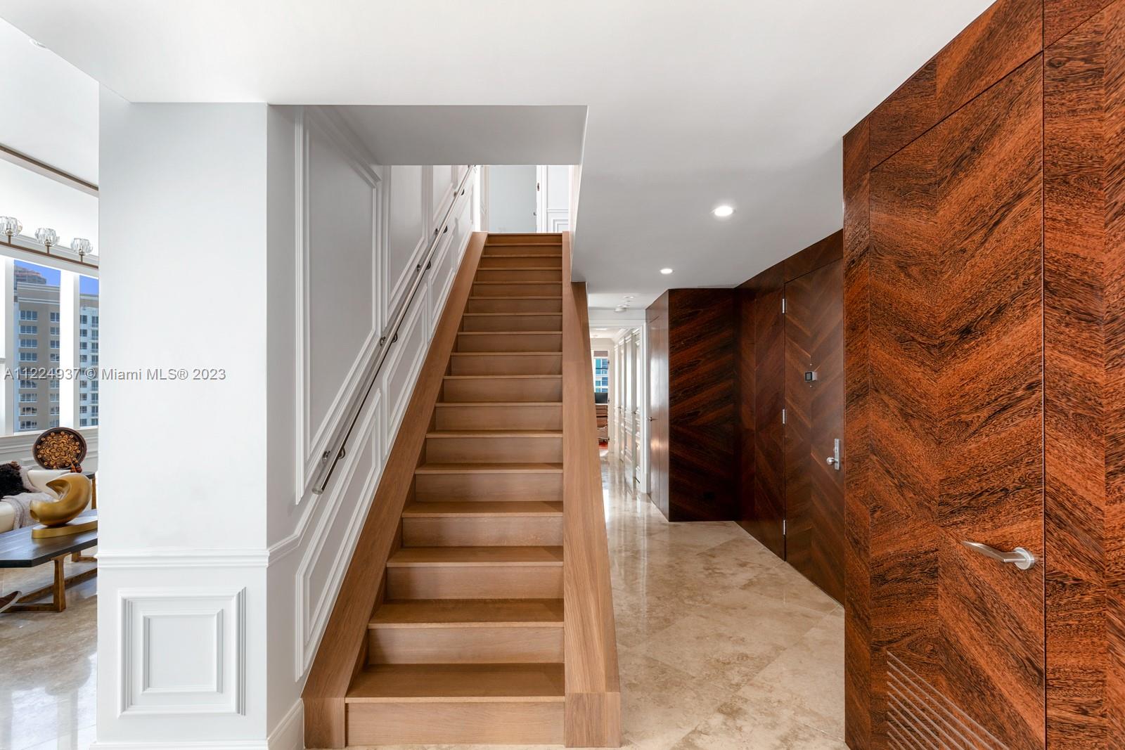 custom staircase and front door foyer entrance