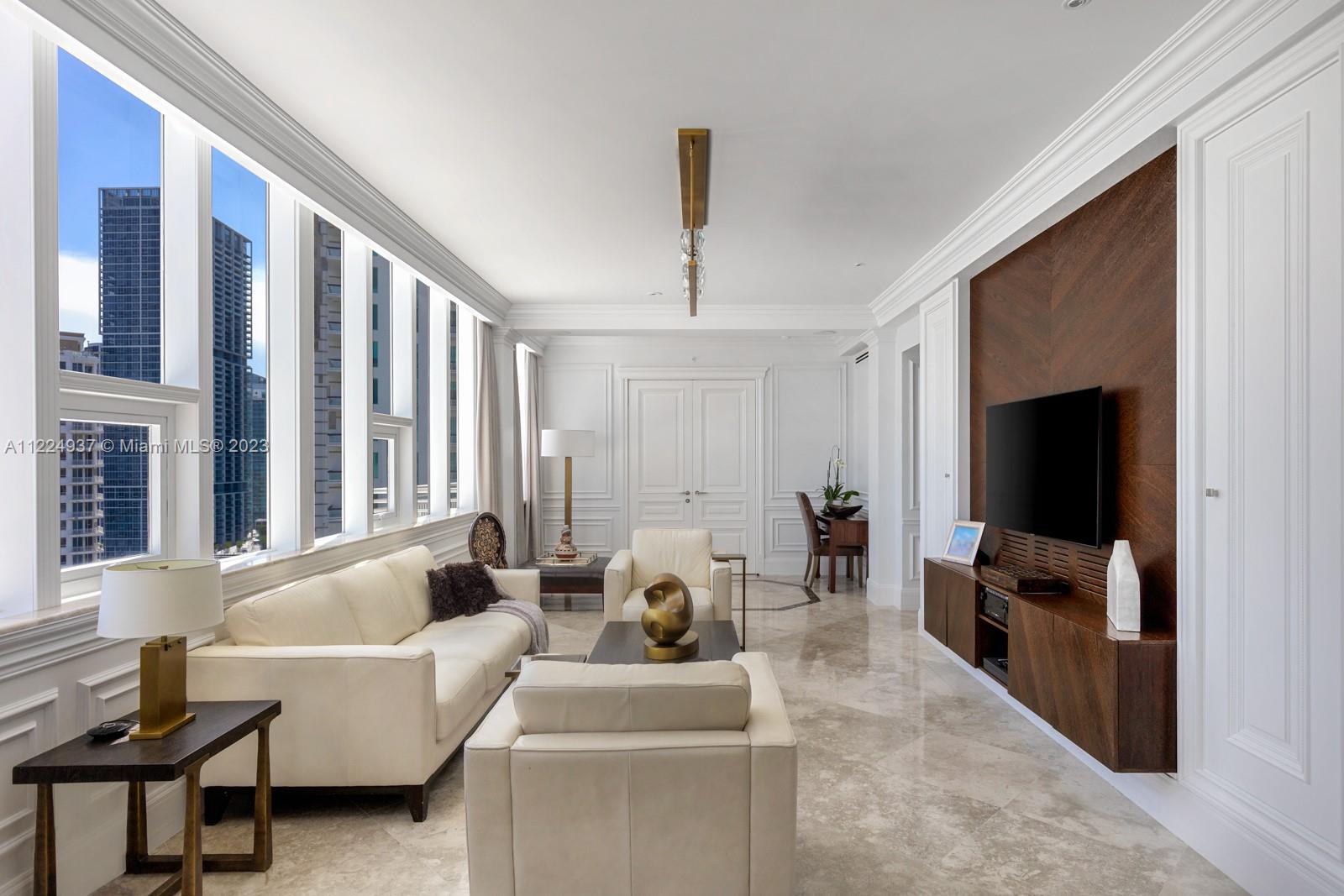 Living Room with oversized windows. Custom Italian and French walls and doors.