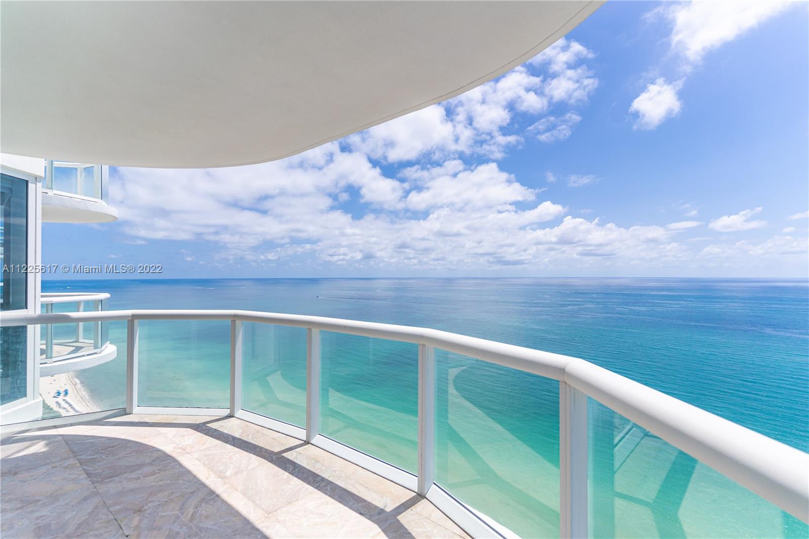 Experience striking unobstructed views of the Ocean, Miami Beach, and the Miami Skyline from this 33rd floor, wraparound balcony, corner unit. Most desirable floorplan (line 3) in the Akoya Condominium. Enjoy luxury living in the second tallest building in Miami Beach. Features include a perfectly delegated floorplan, 12 ft floor-to-ceiling sliding glass doors and windows, marble flooring throughout and a fully equipped kitchen with maple cabinetry, stainless steel appliances, and black granite countertops. Master bath features a Jacuzzi with separate shower and double vanity. Building amenities include a fully equipped fitness center, sauna/steam room, heated pool, tennis & racquetball courts, BBQ area and private beach service. 24-Hour valet parking, lobby and building security.