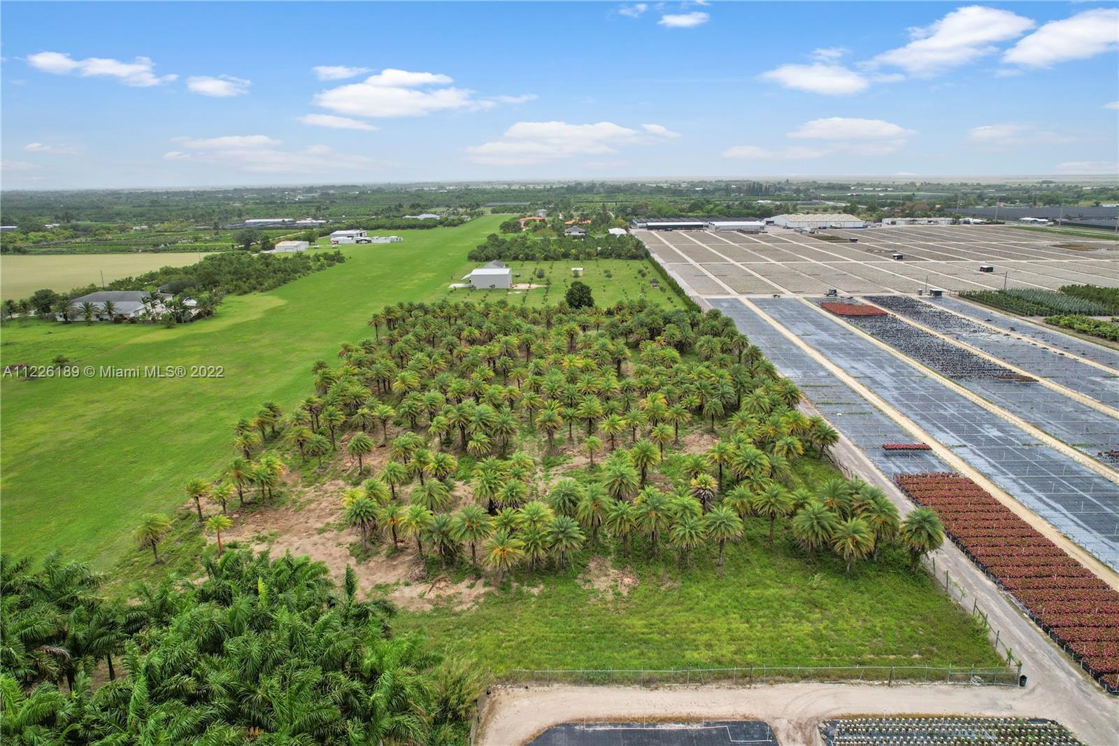 A VIEW WEST THE MAIN ENTRANCE TO RICHARDS IS OFF 202 AVE. A ROAD FOR THE HOMES TO THE NORTH OF AIRFIELD AND ANOTHER TO SOUTH SIDE OF RUNWAY.