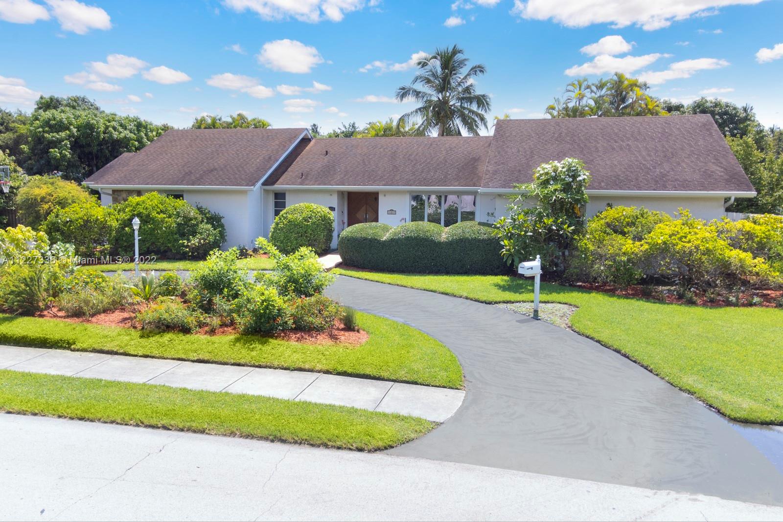 This is the one you have been waiting for.  Very well located LARGE Palmetto Bay home built in 1987 on corner lot.  6 Bedrooms plus a bonus room (office, gym, maid's room) 4.5 bths, high ceilings, 2 car garage. Marble floors, split bedroom plan, 4472 adj. sq.ft   Lush private lot with native wild garden filled with butterfly and hummingbird attractors & fruit trees (banana, mango, avocado, starfruit, papaya).  Open floor plan, indoor laundry room, and nice covered pool-patio are as well...HURRY!!!