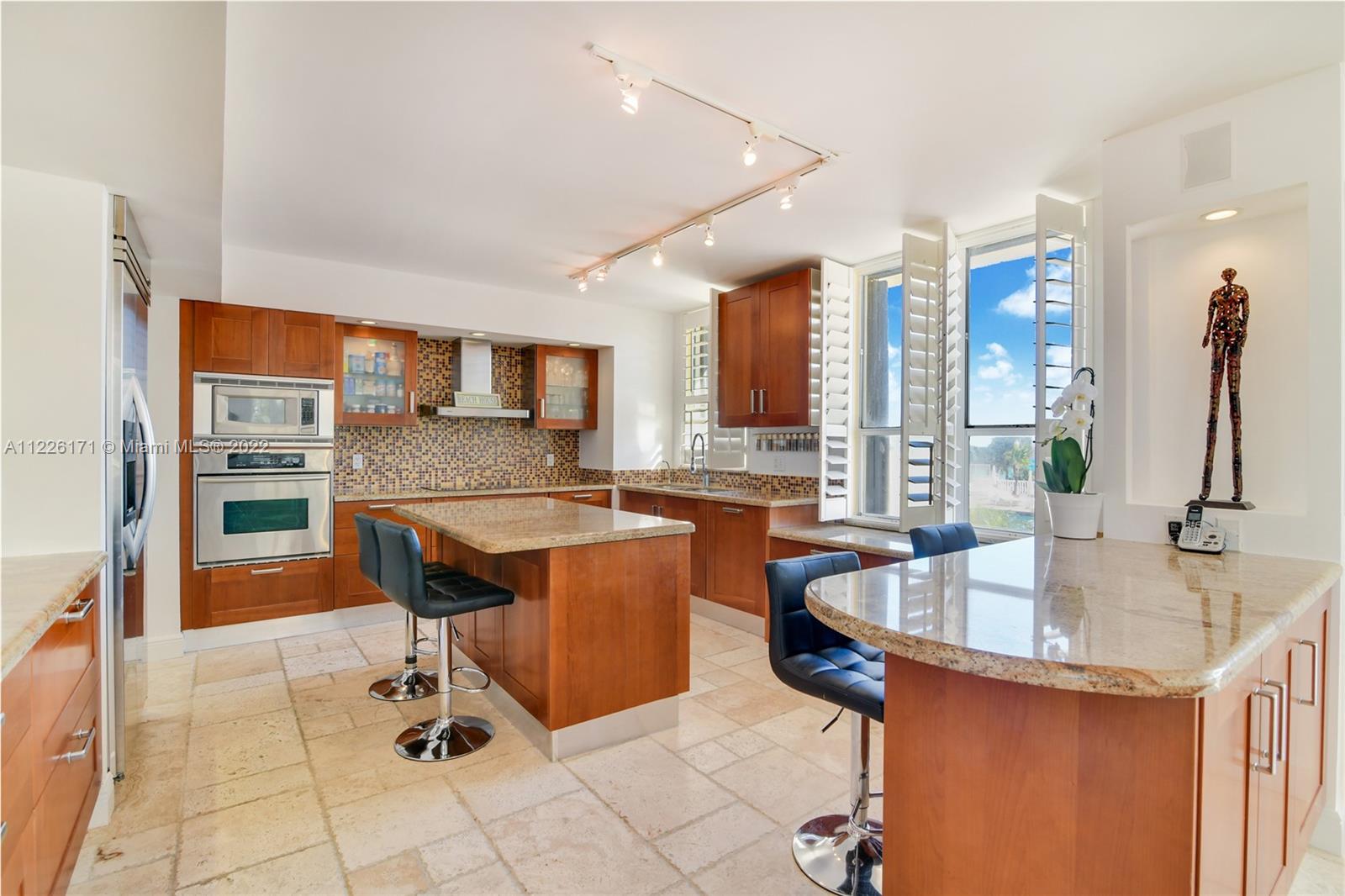 Beautiful open Modern illuminated kitchen  looking the ocean views sunrise