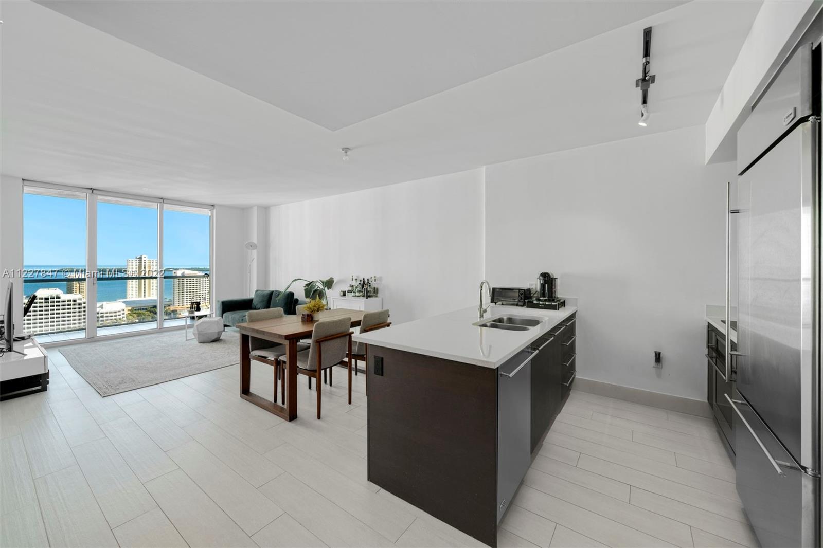AVAILABLE AUG 1ST. A spacious & bright 1-bed condo at 500 Brickell East featuring porcelain tiled floors throughout, stainless steel kitchen appliances, in-unit washer/dryer, blackout shades in bedroom/solar shades in living room, his & hers bathroom vanities, a glass-enclosed shower & separate tub, spacious walk-in closet, and floor-to-ceiling windows w/ direct views of Biscayne Bay & the city skyline from the 28th floor. Building amenities: a rooftop sundeck w/ heated pool, an infinity-edge pool on the 11th floor, his & hers sauna and steam rooms, fitness center, theater, club room, sports room w/ billiards table & kitchen, and 24-hour concierge & valet parking. 1 block from the shops, restaurants, and entertainment at Brickell City Centre. Can be rented turnkey furnished for $4,500/mo.