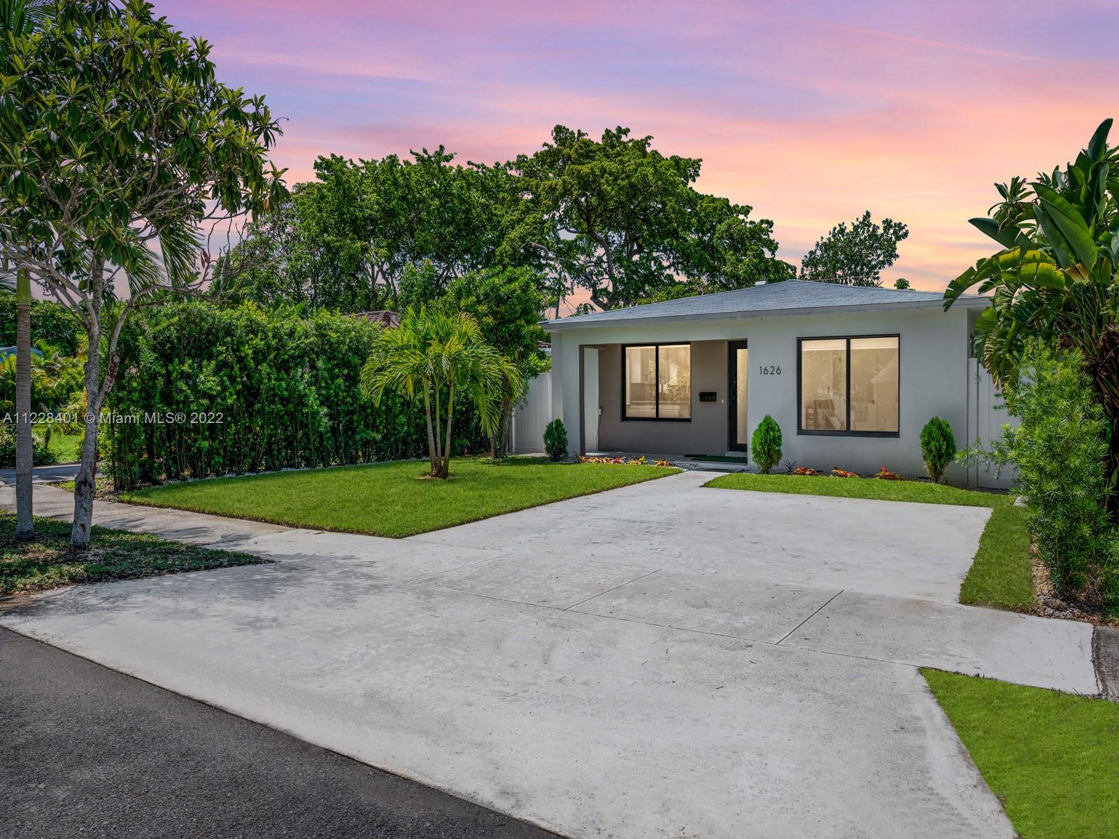 BEAUTIFULLY RENOVATED HOME LOCATED IN THE HEART OF HOLLYWOOD EAST OF US-1!! This 3/2 has beautiful new Italian tile flooring, a brand new roof, brand new sleek hurricane impact windows, new sprinkler system, 3 year old AC unit, and a 2 year old tankless water heater. Beautiful french doors in one of the rooms give access to a expertly manicured and spacious back yard where you will have two sheds for all your storage needs. A covered area with artificial turf is the perfect space for entertainment/grilling area/etc. Guests will absolutely enjoy the brand new walk-in showers with modern glass shower doors. The kitchen features brand new appliances and an open concept that allows for seating up to 4 people at the counter. Can be fully furnished or unfurnished as needed and negotiated.