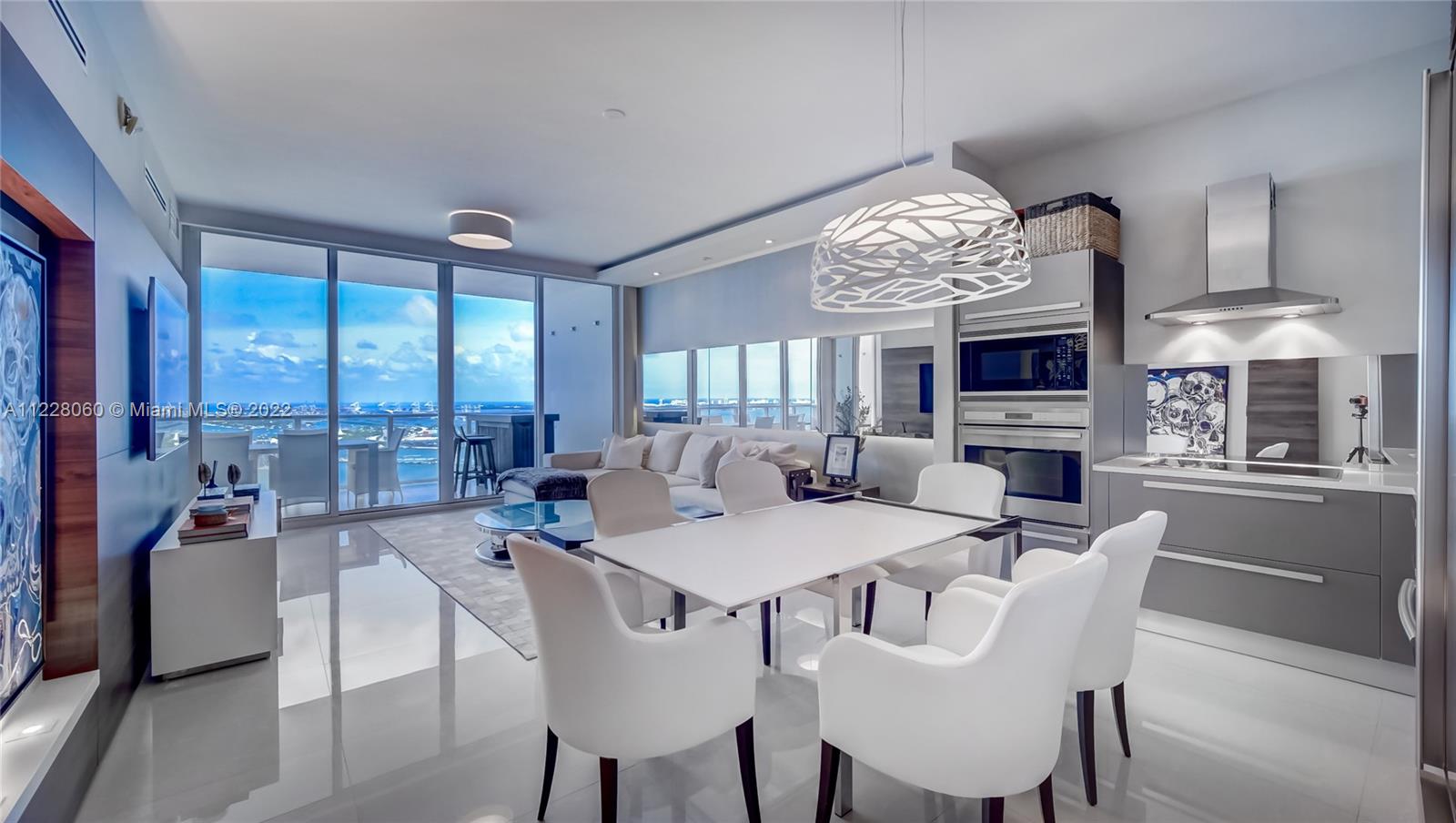 This stylish & spacious 1 bed + bonus room/2 bath unit is nestled on N Bayshore Drive, the most sought-out waterfront street in Edgewater at the elegant Paramount Bay. Set on the rarely available & best selling 4th tower, via a private elevator, you arrive to your own lobby! Features: Sophisticated airy space flows between the 8' deep terraces & its 10' ceilings you'll love waking up to unobstructed endless water-views thanks to floor to ceiling glass doors. The open kitchen incl Sub-zero appliances, gorgeous floors, custom built-ins, w/d. The Master suite: walk-in closet, dual sink & shower. Luxurious amenities are the core essence of living here from it's sunrise/sunset pools, 2-level full-service fitness center & spa, game room, lounge areas, library, 24hr security, concierge + more.