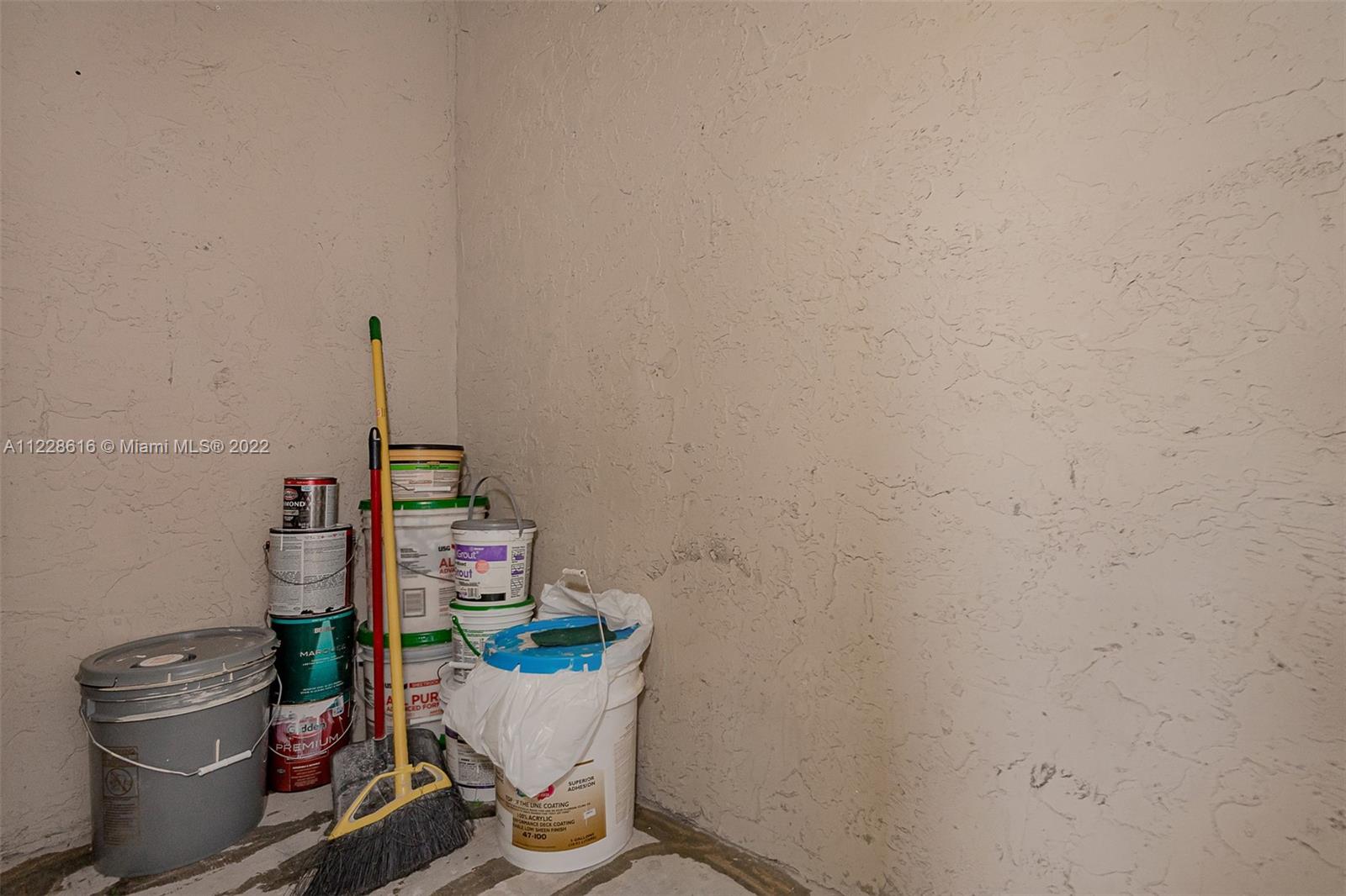 The interior of the storage room off the porch area.