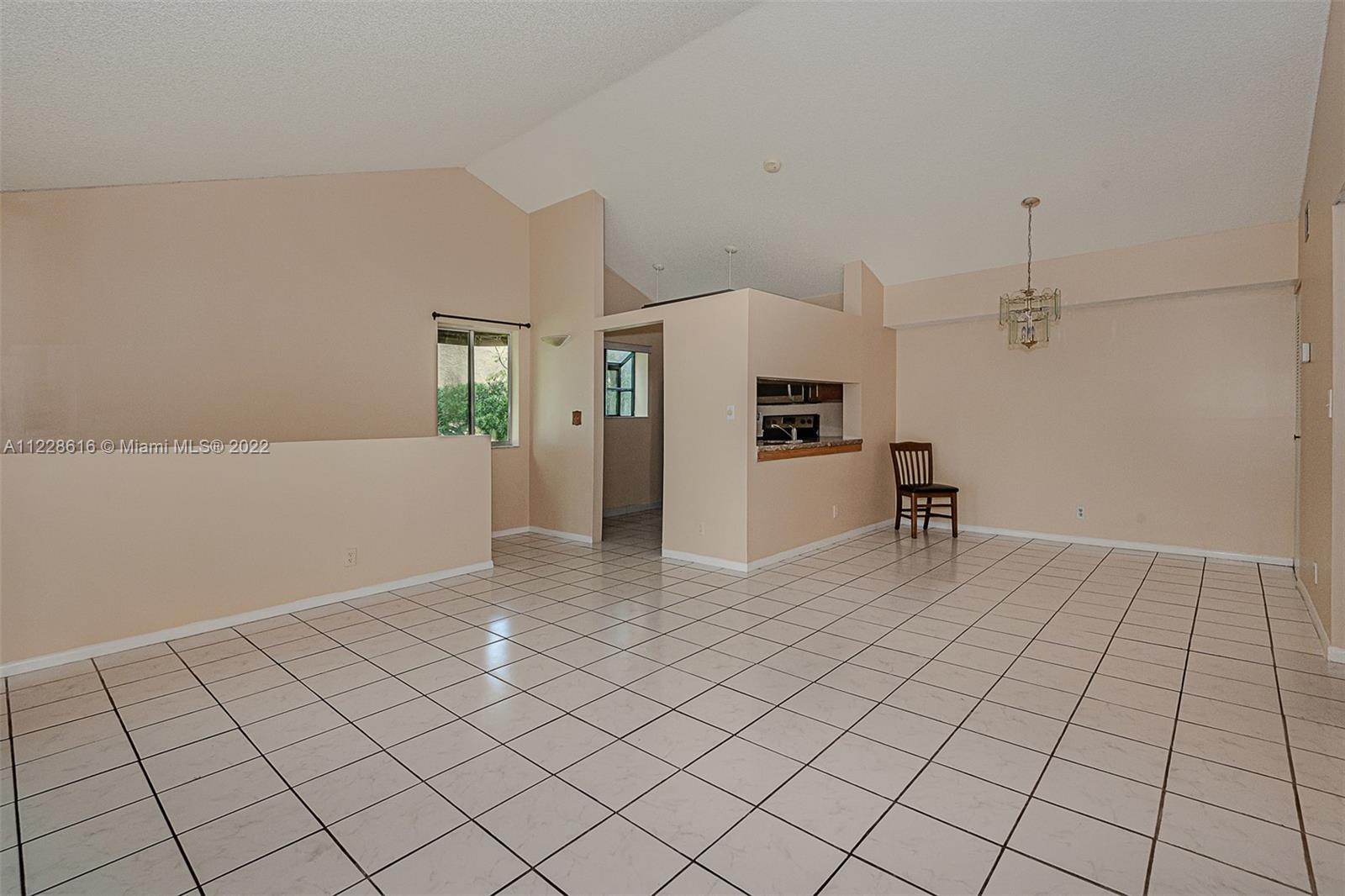 Living room toward the kitchen and dining area.