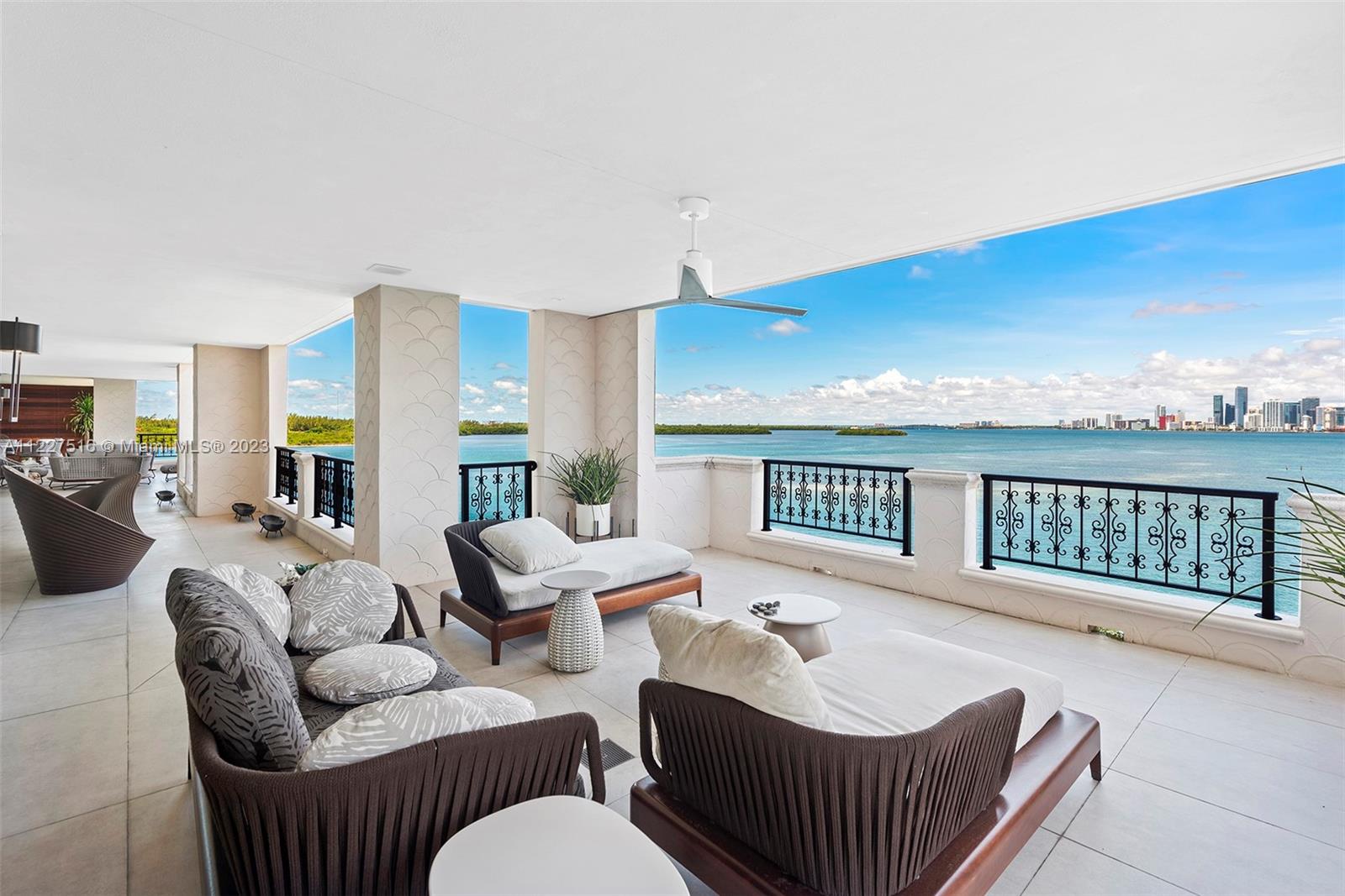 This masterfully crafted unit was meticulously gutted and reconfigured into an open-plan, modern condominium by creative director Sofia Joelsson. The flow-through unit overlooks the Atlantic Ocean, Biscayne Bay and Downtown Miami and it is surrounded by a deep wraparound balcony with spaces for entertaining and other outdoor activities. The inspiration for the project was a modern vibe with a focus on art with approximately 6,000 sqft living area, 4 bedrooms, 4.5 baths, porcelain concrete style floors, home theater, open kitchen with postcard views of the Miami Skyline, plus a custom walnut wet bar. In the master suite, the view looks straight east for the perfect sunrise and a one of kind master bathroom.