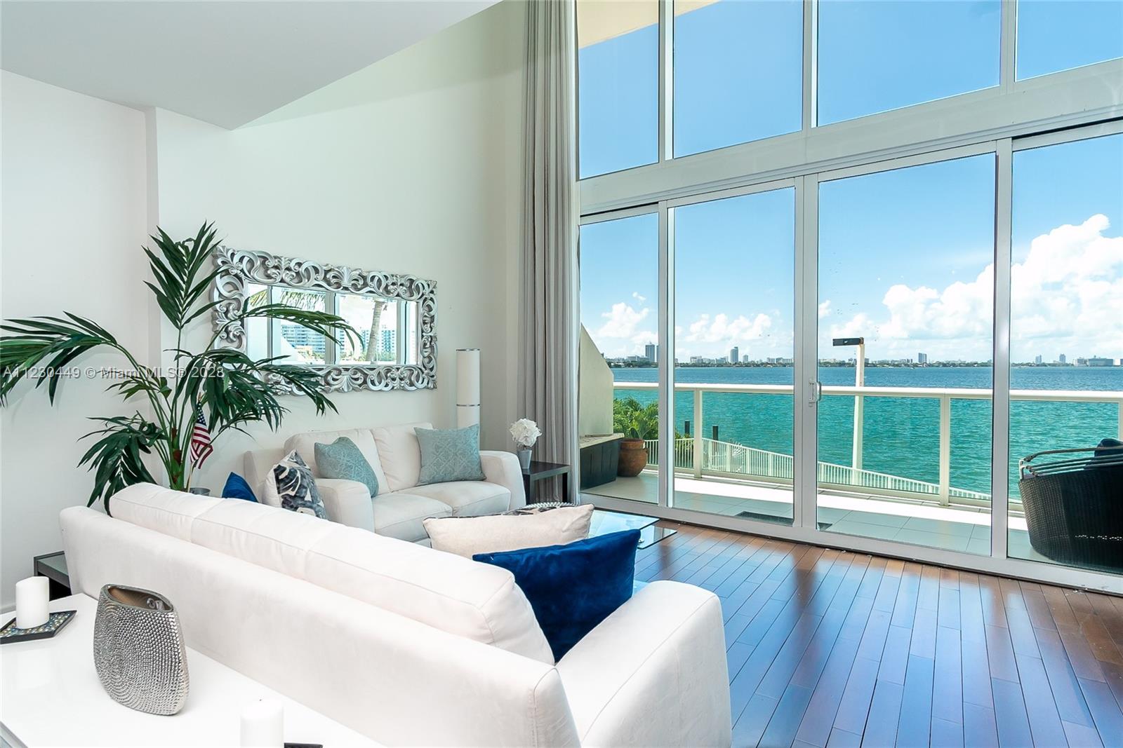 Fall in love with and make this your next dream home! Unobstructed & magnificent views of Biscayne Bay & downtown Miami through its private balcony. This incredible loft style unit boosts over 1,400 SF of living area, no room feels small! Eat in kitchen with SS appliances. Two master bedrooms, walk-in closet, wood flooring throughout. Half bath on the 1st floor & a huge storage/pantry. Gated & covered parking. Bay View Lofts is an elegant & luxurious boutique condo conveniently located on Normandy Isles. Amenities include swimming pool with a spectacular deck overlooking the bay, fitness center & sauna. 5 min drive to the beach, A+ schools, entertainment, minutes drive to the exclusive Bal Harbor shops & the Miami International airport. Walgreens & gas station within walking distance.
