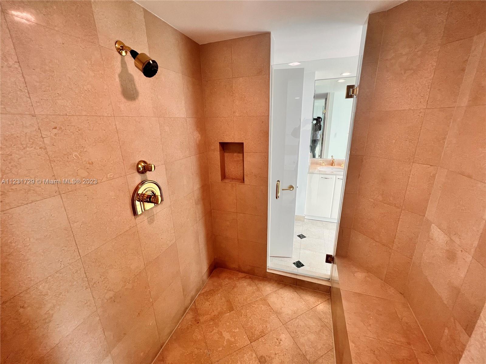 Master Shower joining His & Her Bathrooms