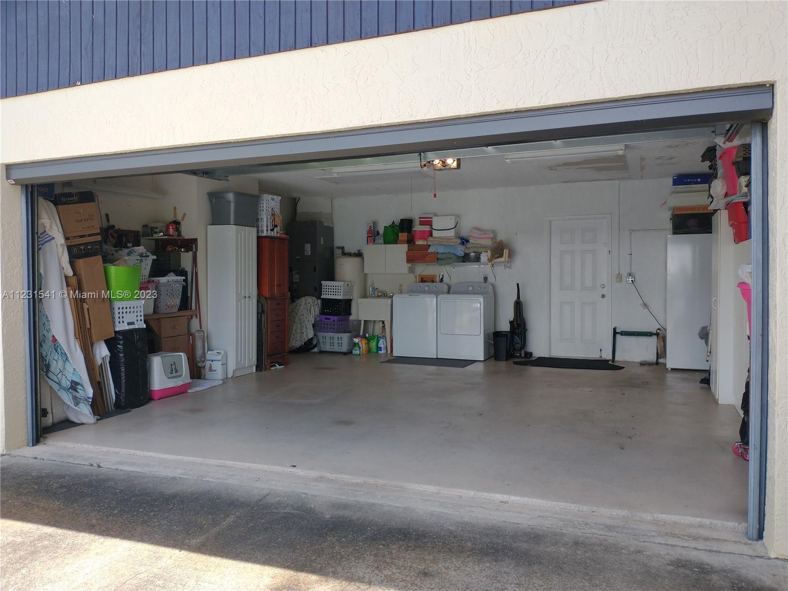 Back yard, open porch, and storage shed.