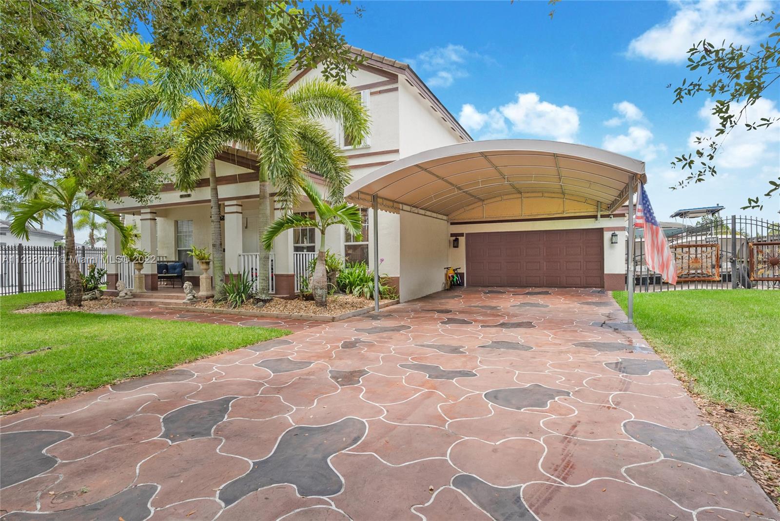 Front of the house, double garage, carport, space for boat and/or RV parking on side of the house behind fence.