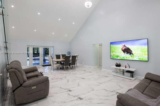 Redlands living at its finest! This sprawling 10 acre property will not disappoint, and has been completely remodeled with only the finest materials and finishes! Everything is new--roof, plumbing, electrical, water filtration systems, impact windows, and more! Open living area with high ceilings and recessed lighting! Large closets, all with custom shelving. Beautiful kitchen with stone counter tops and wood cabinets and a full array of stainless steel appliances! Walk in pantry is a plus! Second floor features a glass staircase with bonus entertainment area and room, as well as huge balcony overlooking the grounds. Property is completely fenced, with separate areas for farm animals. Income producing mango and avocado grove! This one will not last! Schedule your private showing today!