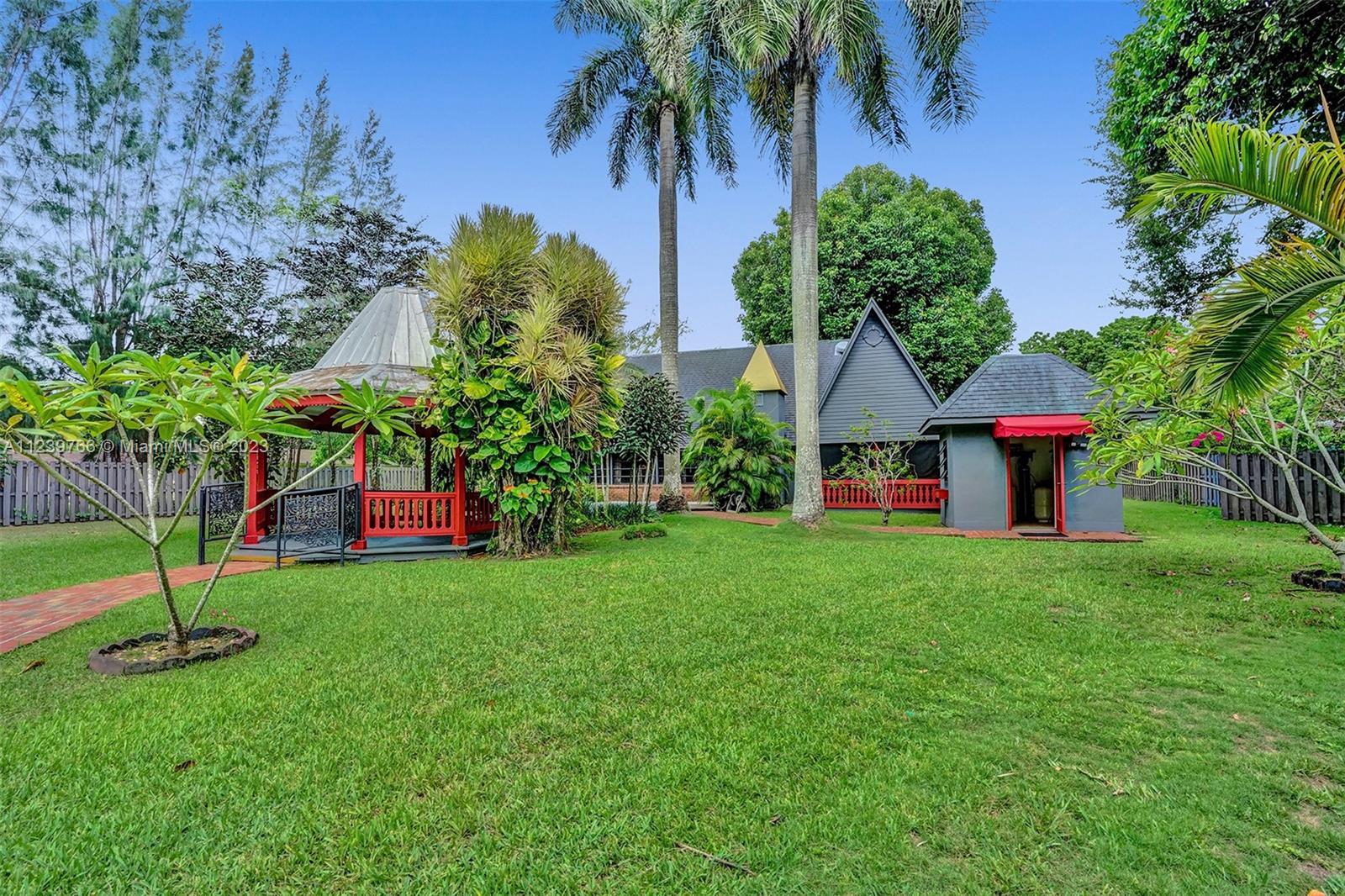 Priced to Sell! Welcome to Wonderland! Private Estate. Main house 3 beds/2 baths & separate 1 bed/1 bath guest house on a beautiful 50,000+ square foot lot. Main house features vaulted ceilings, updated kitchen, topline stainless steel appliances, open living/dining rooms with a fireplace and all new A/C system and ducts. Separate guest house has its own kitchen, full bath & loft bedroom and 2 walk-in closets. Lushly landscaped gardens and giant wood gazebo perfect for family entertainment complete with a custom-made playhouse and separate laundry room. Located on a quiet street with room for a pool and tennis court. Ideal location within steps to South Miami, top schools, shopping, U.S 1 and easy access to the Palmetto Expwy. Priced to Sell!  Call to schedule your private showing today!