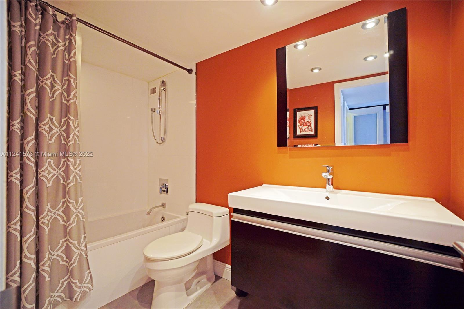 Master on-suite bathroom with tub & shower combo.